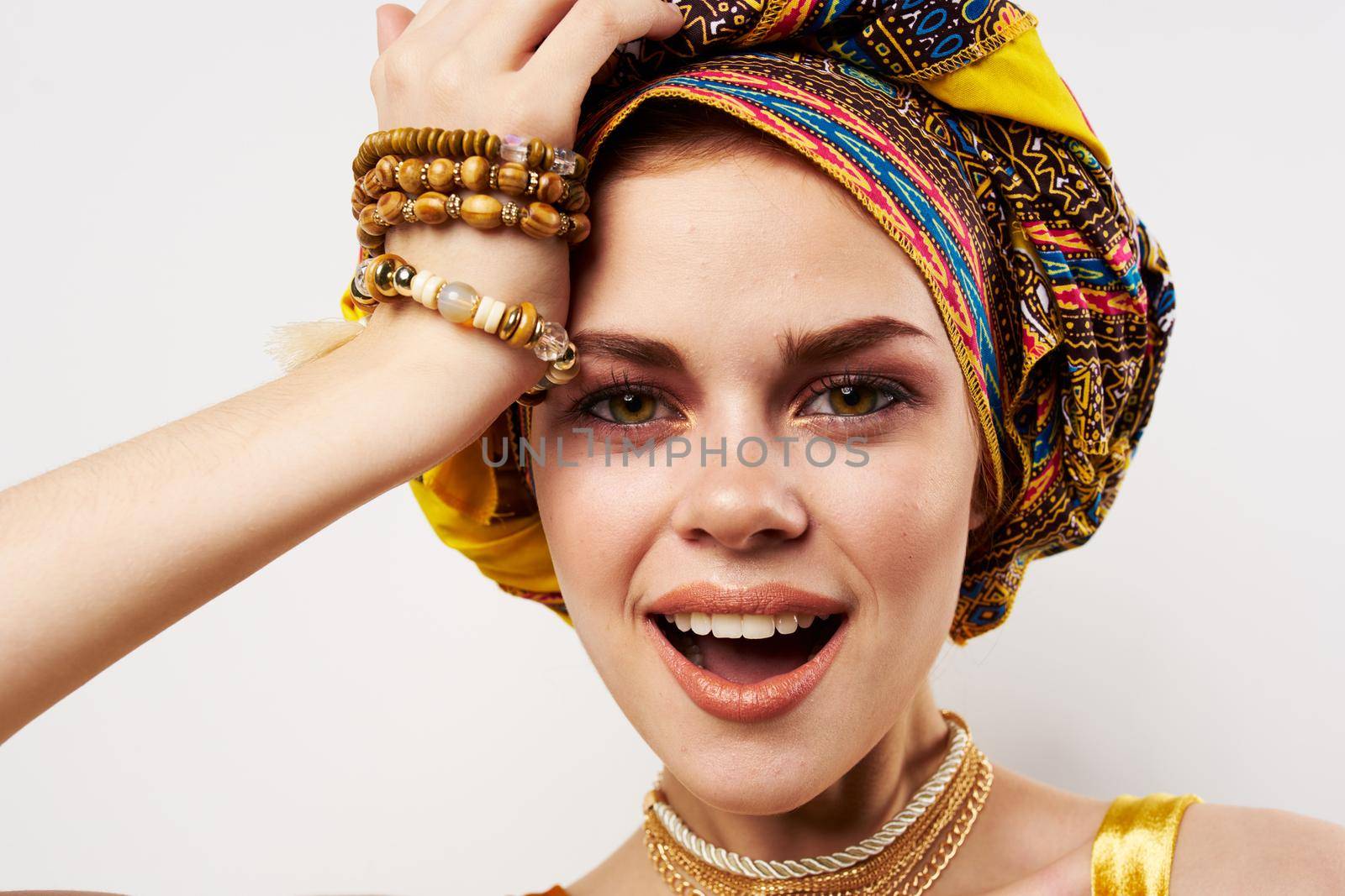 cheerful woman multicolored shawl ethnicity african style decorations Studio Model. High quality photo