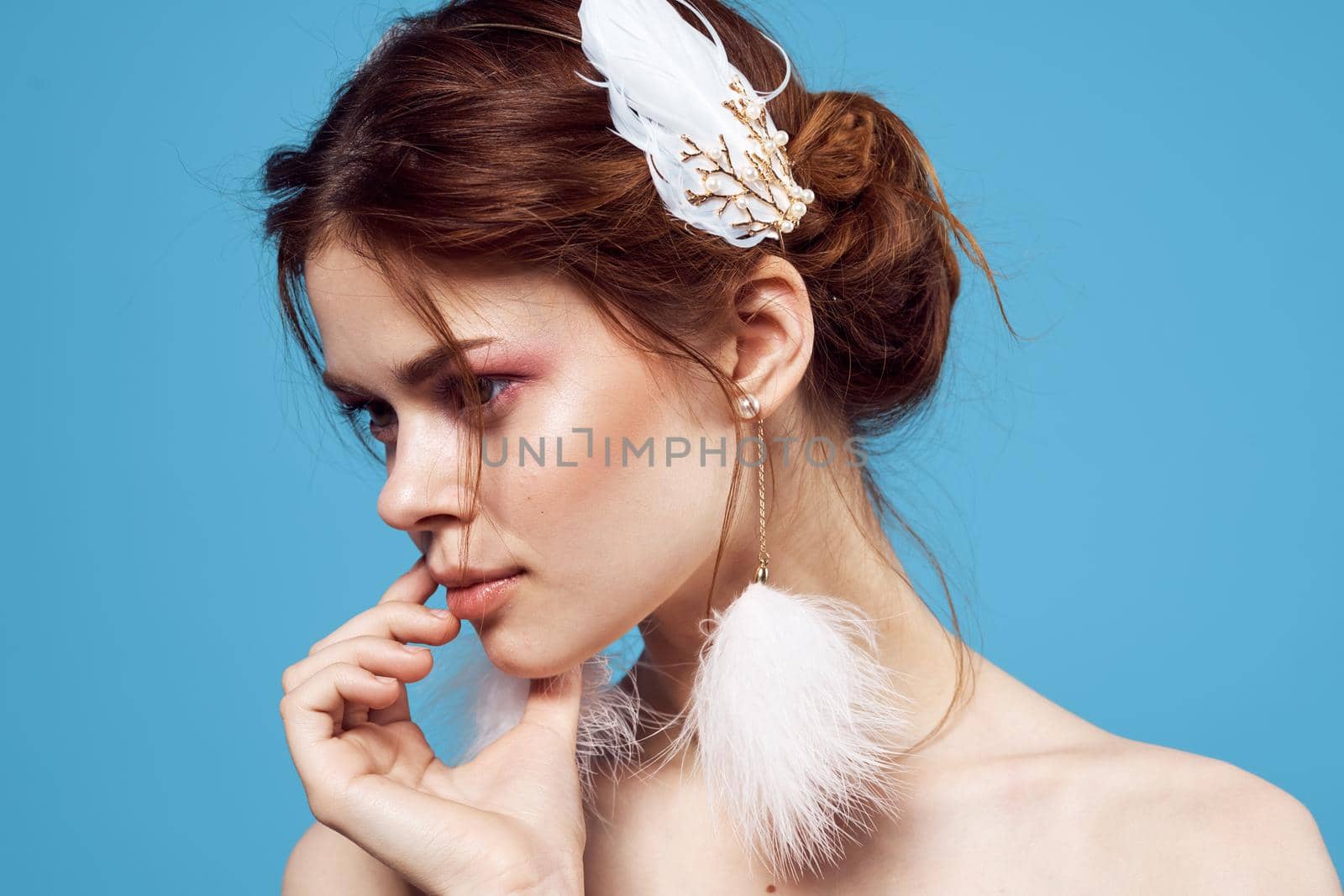 glamorous woman bright makeup decoration posing blue background. High quality photo