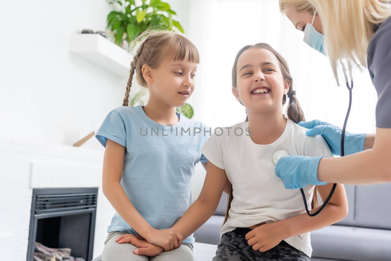 young doctor with little girl patient feeling bad medical inspection with stethoscope