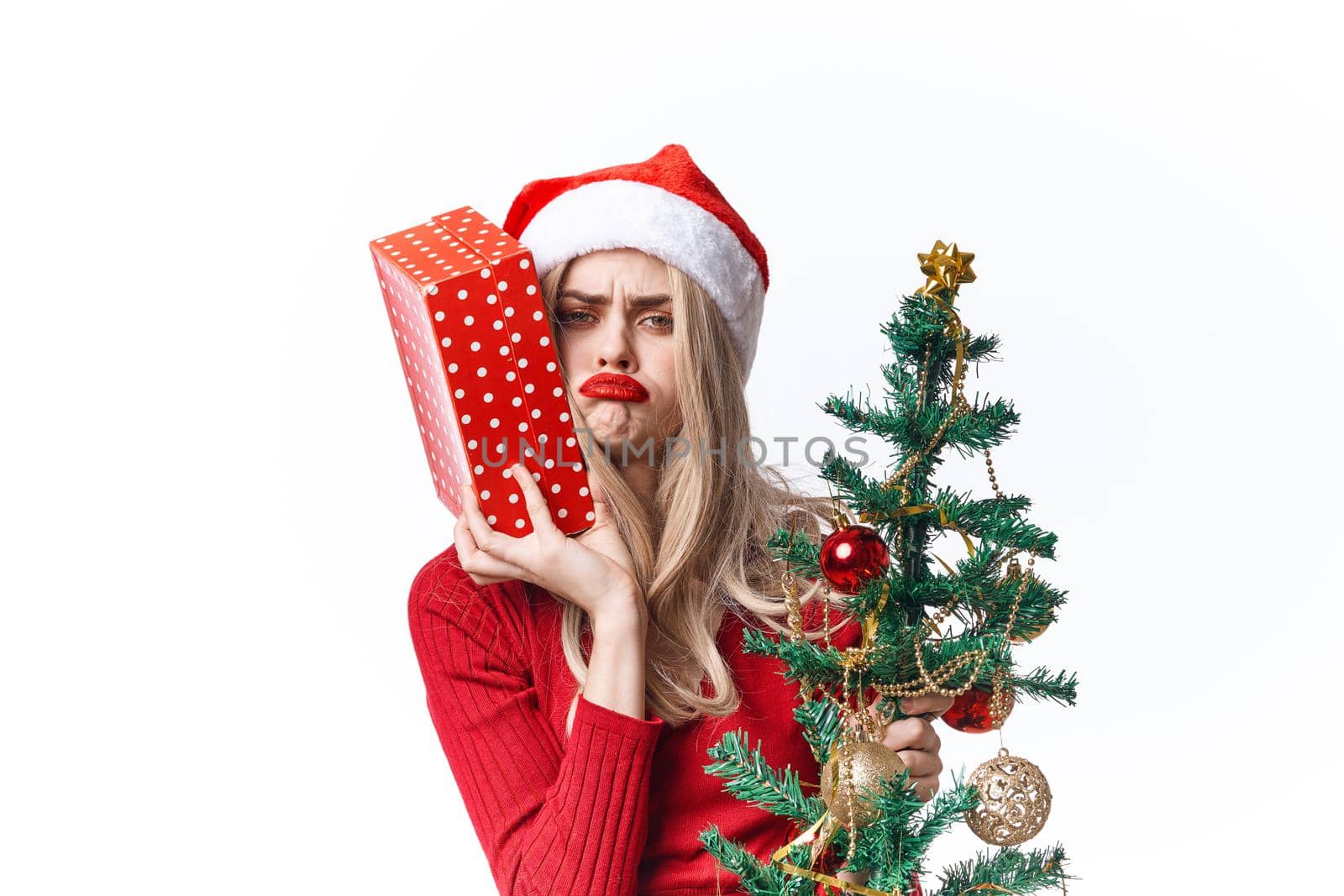 woman wearing santa hat gift holiday lifestyle tradition christmas. High quality photo