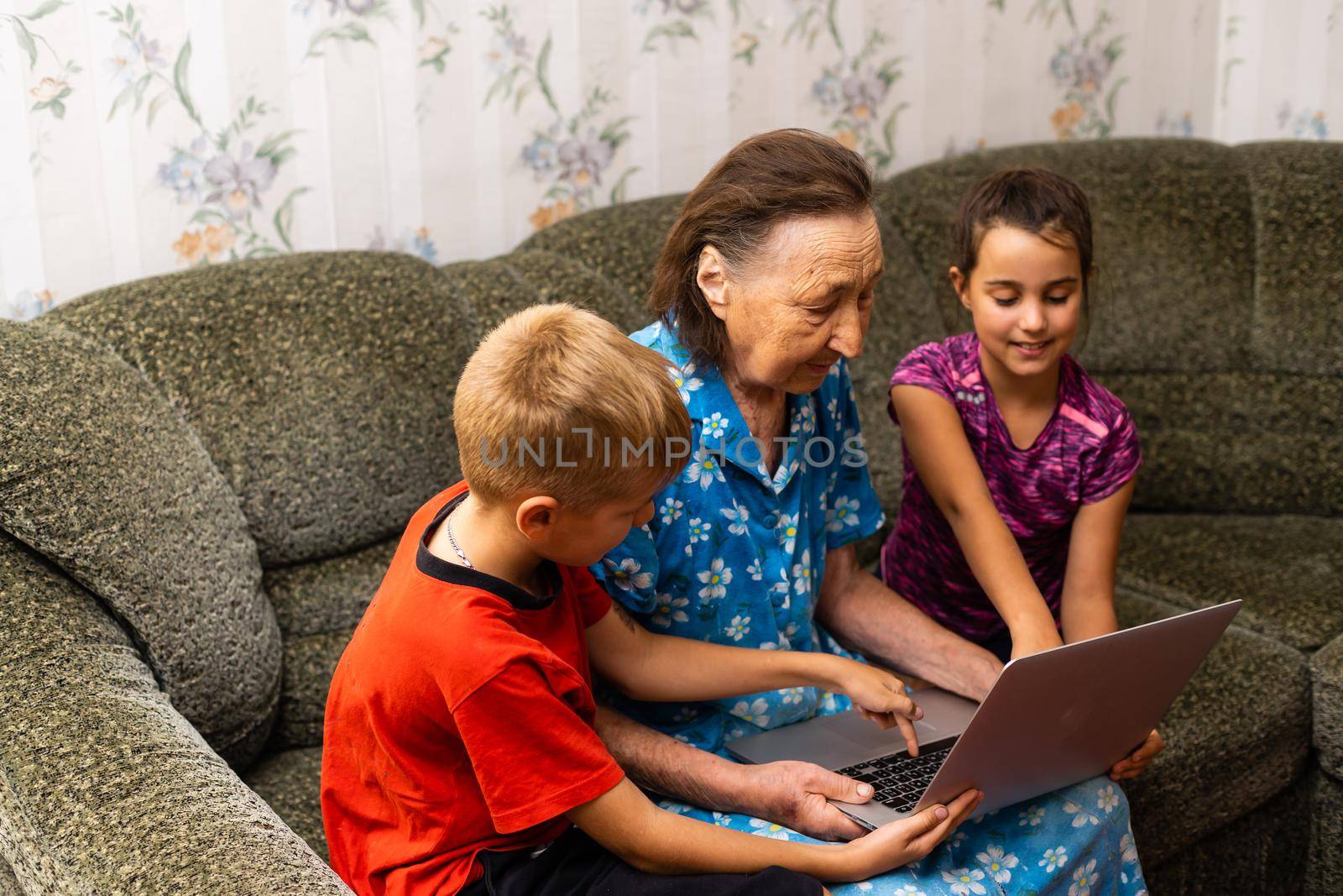 Grandmother with grandchild. Old woman with children by Andelov13