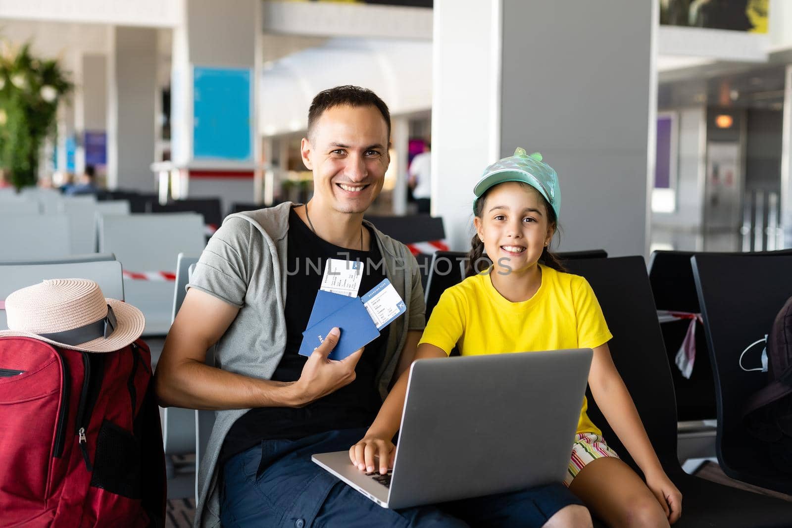 businessman with daughter in airport. Travel time. by Andelov13