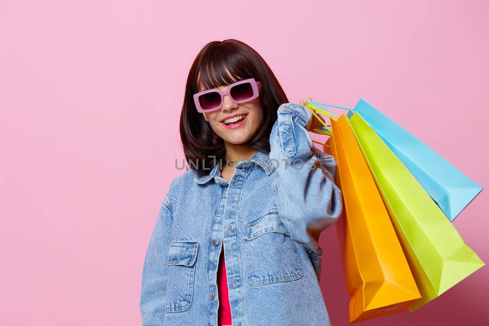 young woman shopping in the store fun entertainment isolated background by SHOTPRIME