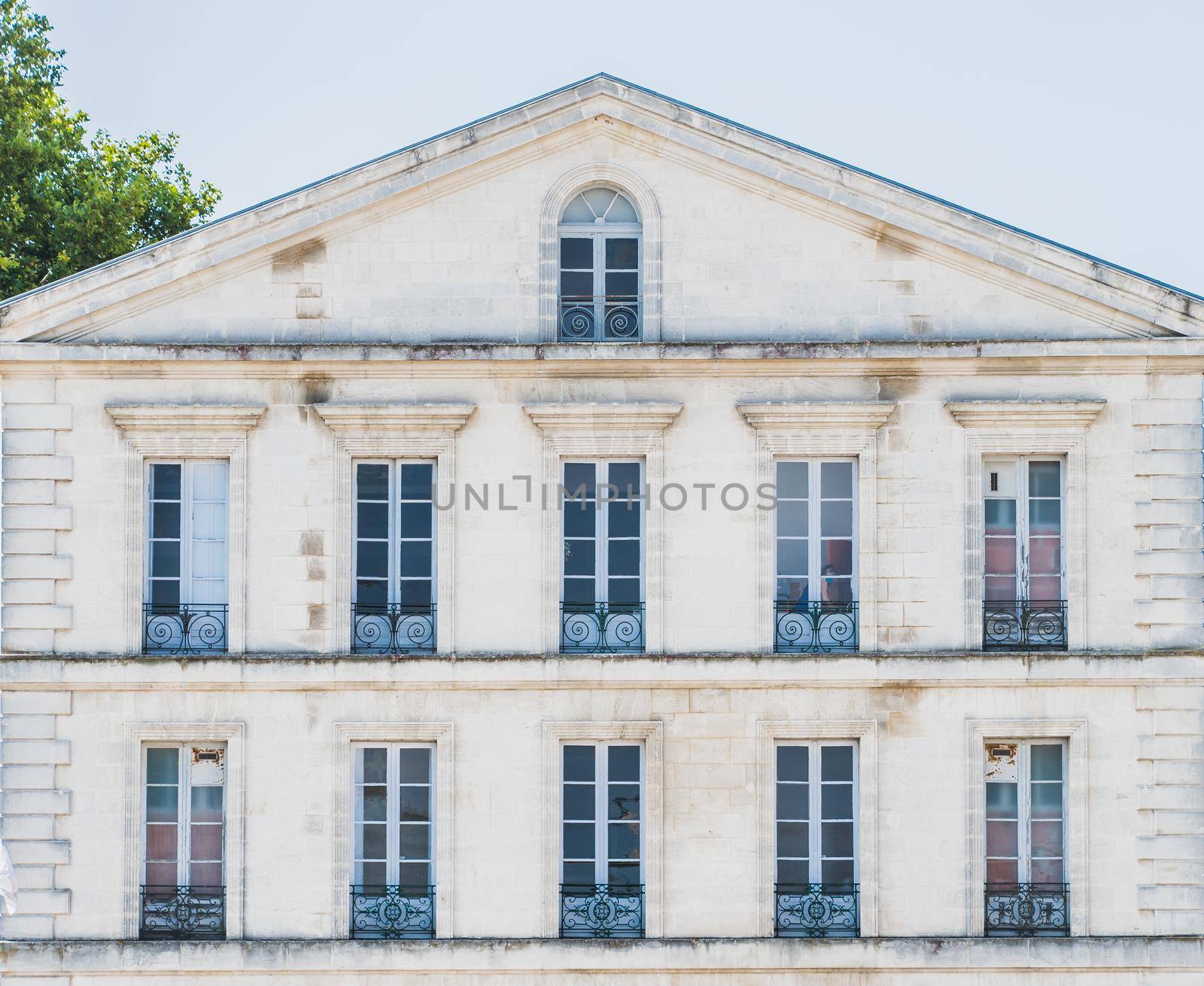 Architectural building with windows and railings o Rochefort in France