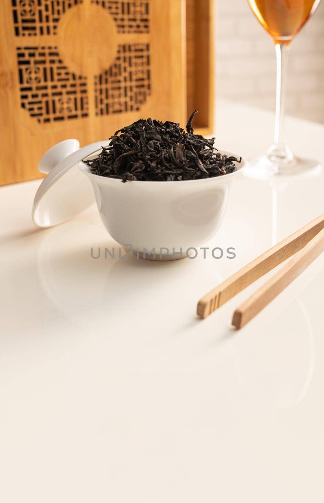 tea table with appliances and wine glasses, in which large-leaf tea is brewed