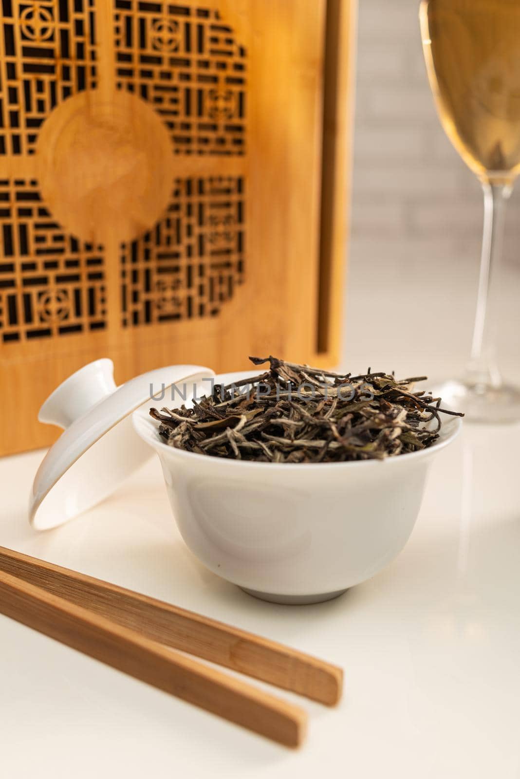 tea table with appliances and wine glasses, in which large-leaf tea is brewed