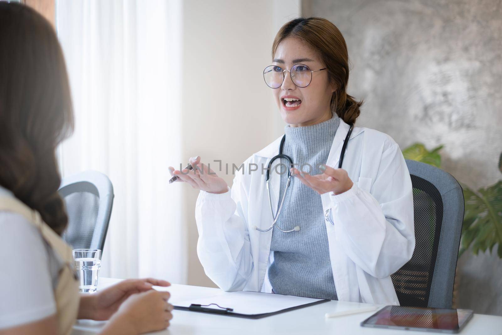 Doctor discussing and explain to patient about life plan. Medicine and health care and insurance concept