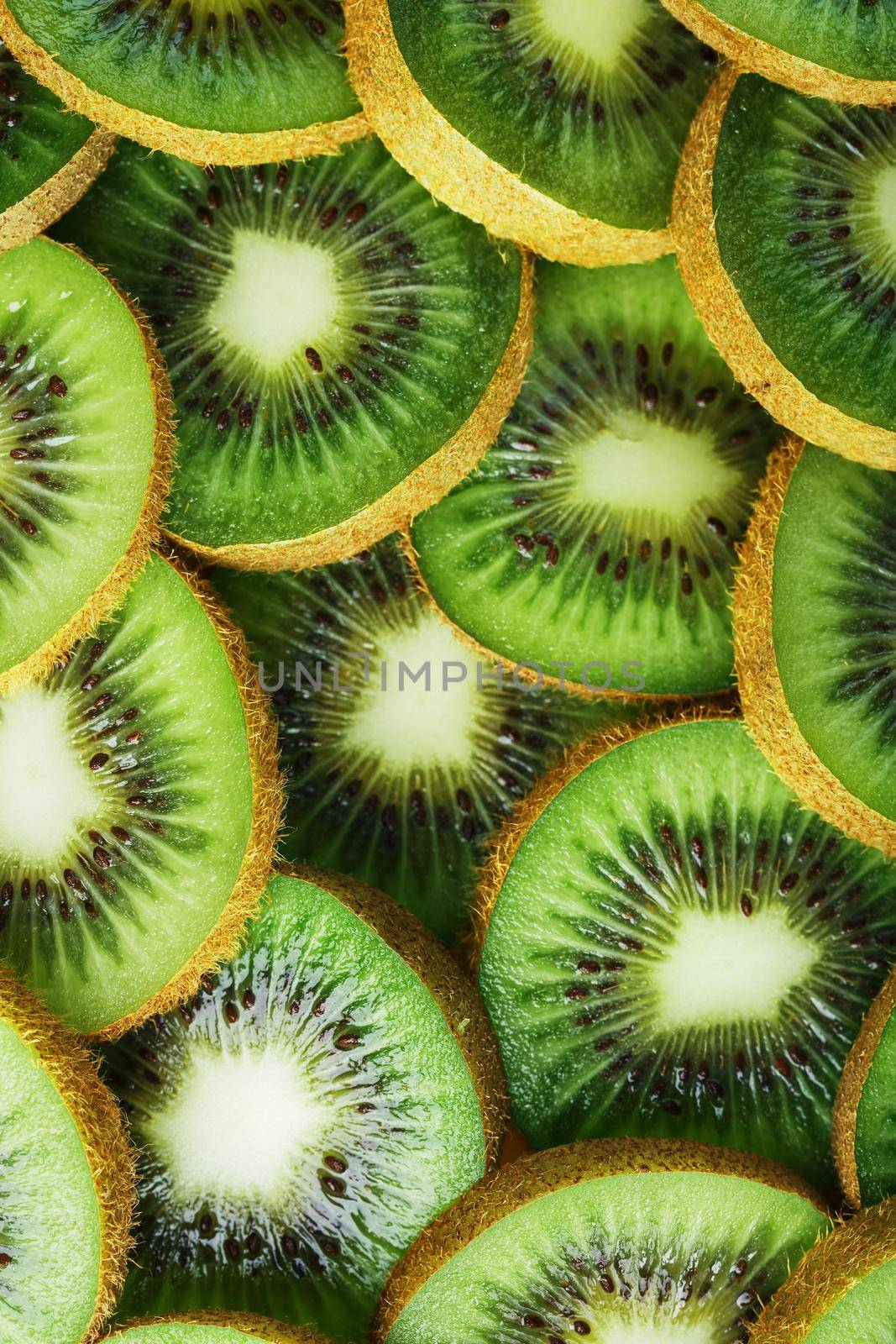 Kiwi fruit close-up wedges with a pattern in the form of a pattern. Background concept, top view