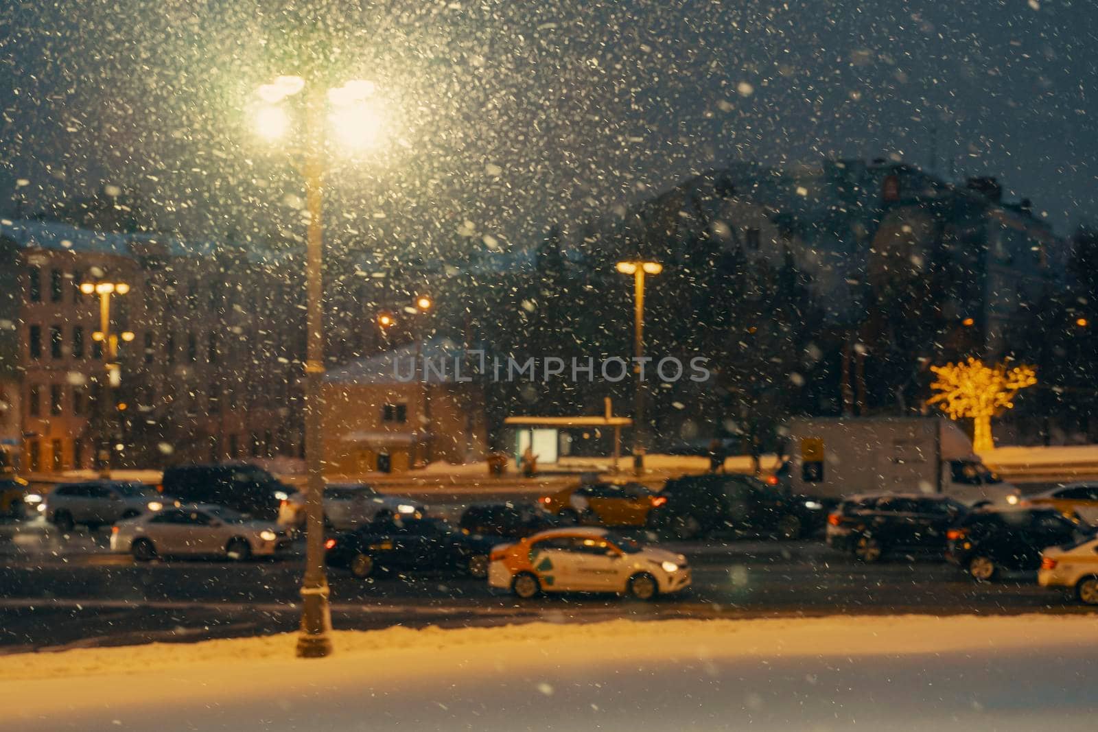 01.22.2022 Moscow, Russia. road traffic in the center of Moscow at night in snowfall, poor visibility, blur