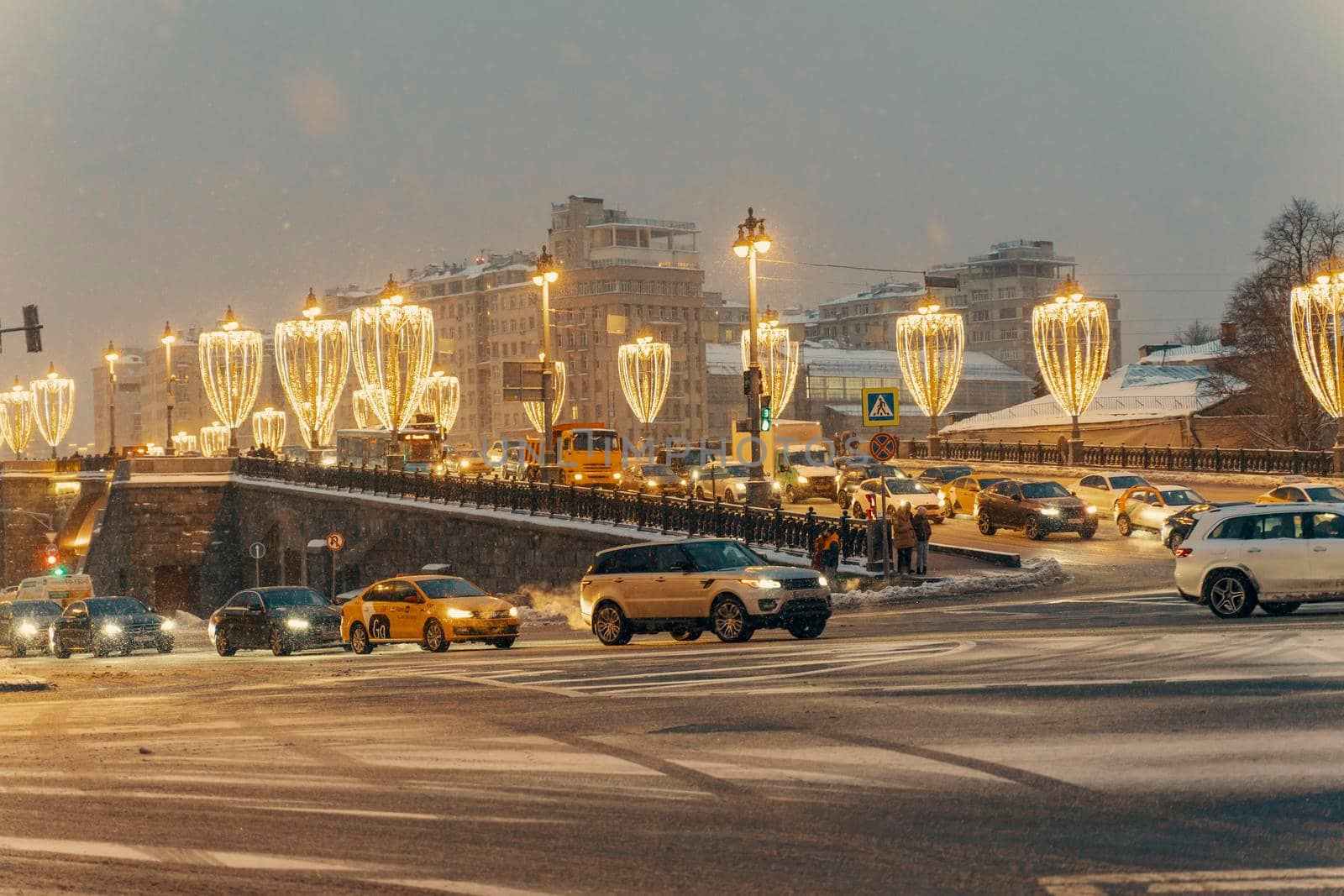 Bolshoi Moskvoretsky Bridge on a winter snowy night by Lena_Ogurtsova