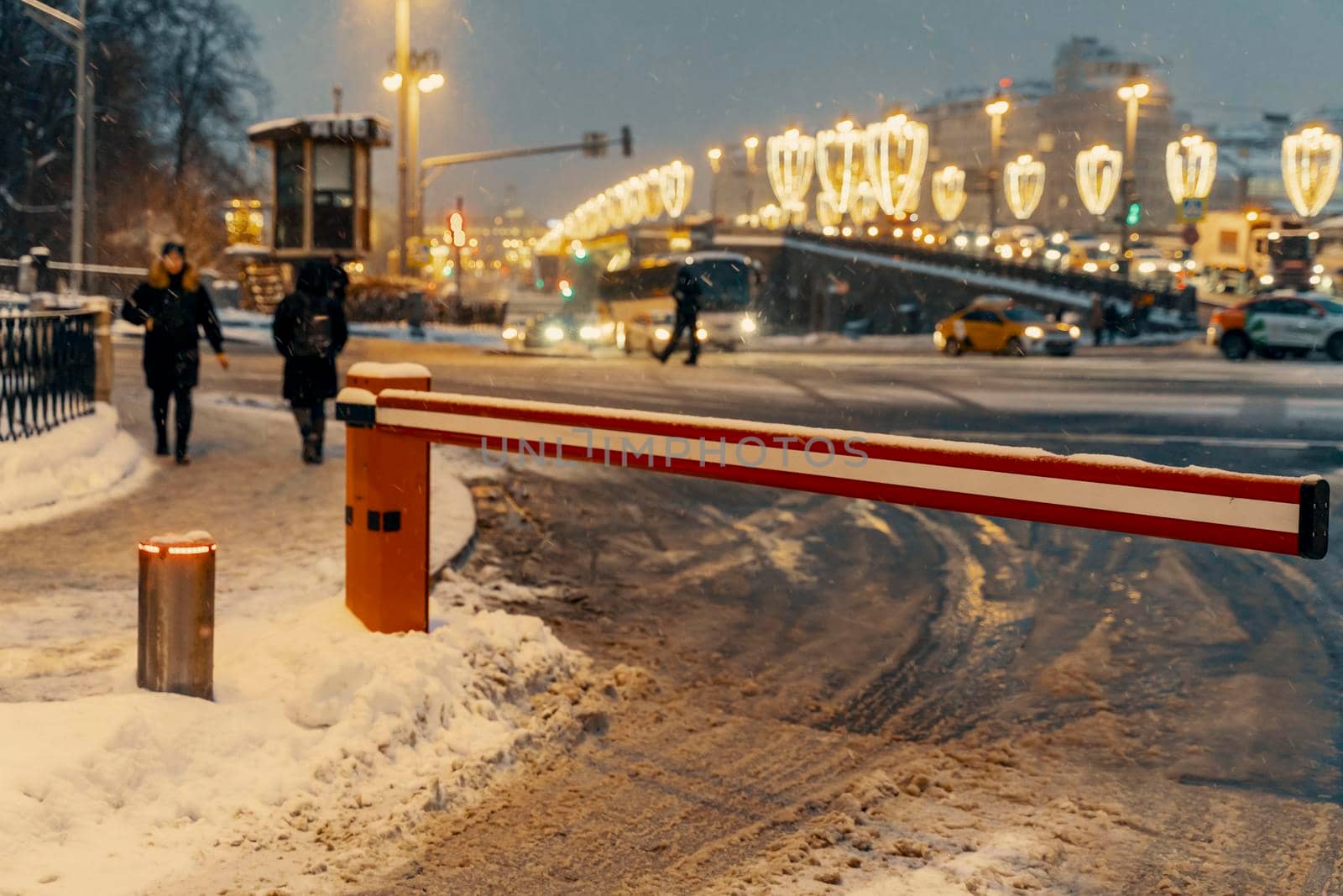 01.22.2022 Moscow, Russia. road closed barrier on a snowy winter night near the moskvoretsky bridge