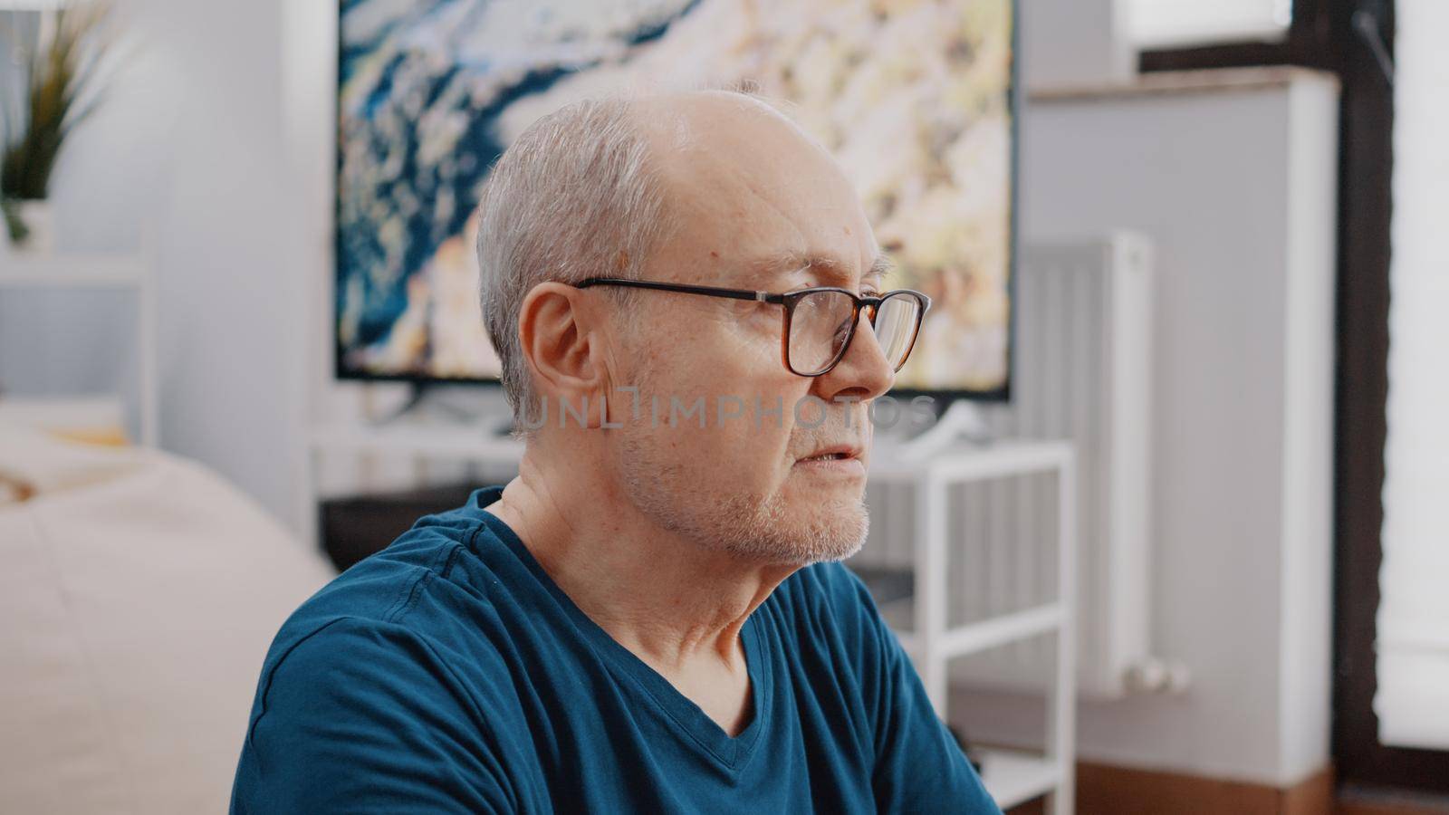 Close up of senior man doing wellness exercise and breathing while meditating after workout. Retired adult relaxing with meditation activity to practice yoga recreation and wellbeing.