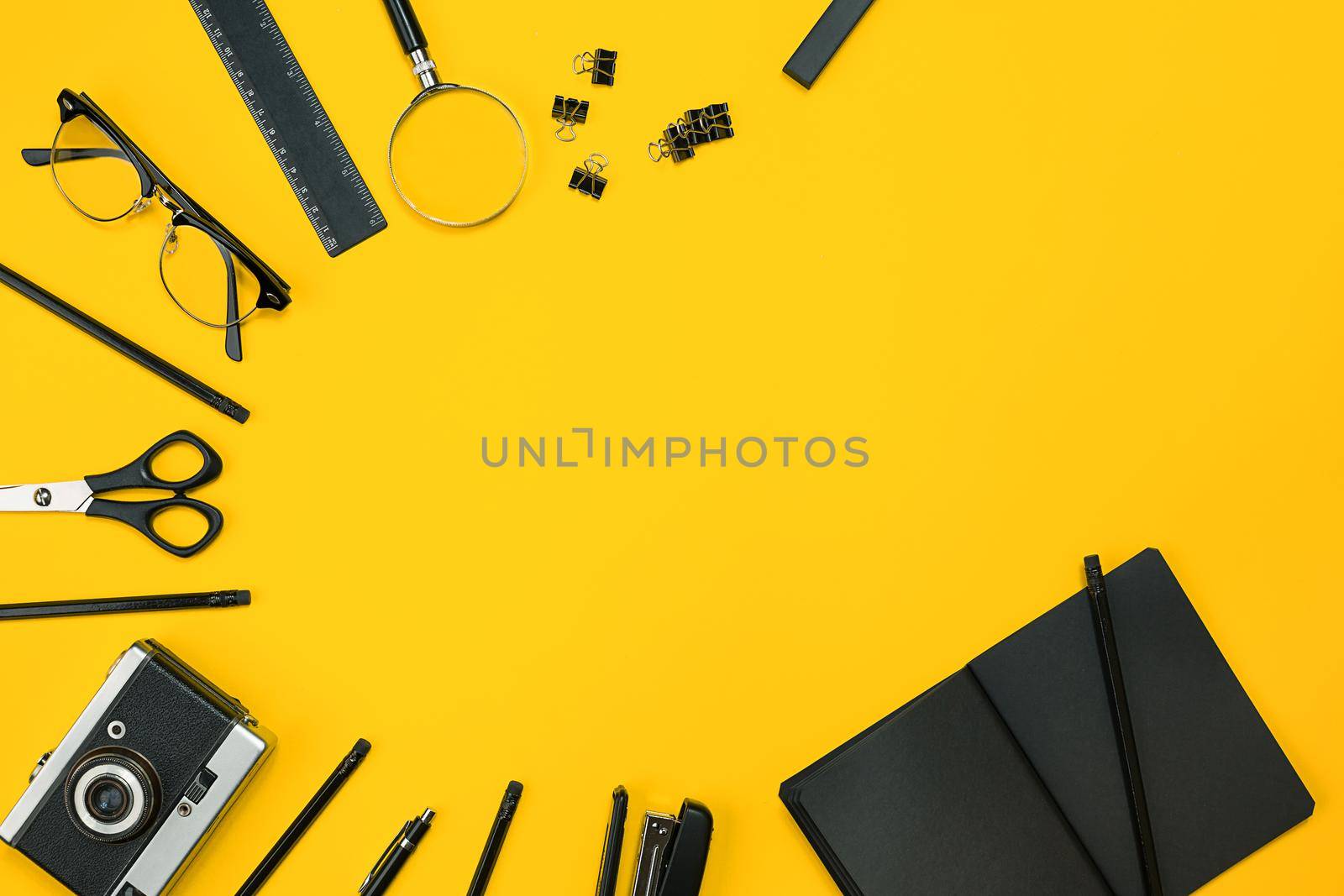 Workplace with office items and business elements on a yellow background. Concept for branding. Top view. Copy space. Still life