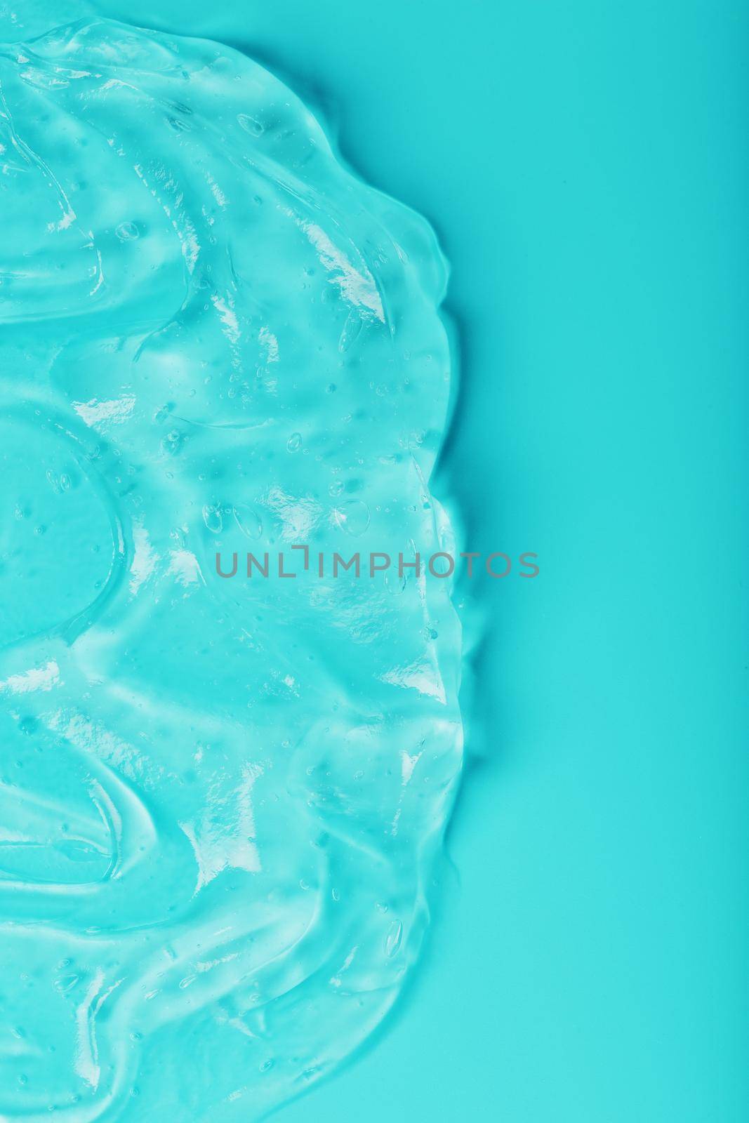 Antiseptic gel on a cyan background in waves. by AlexGrec