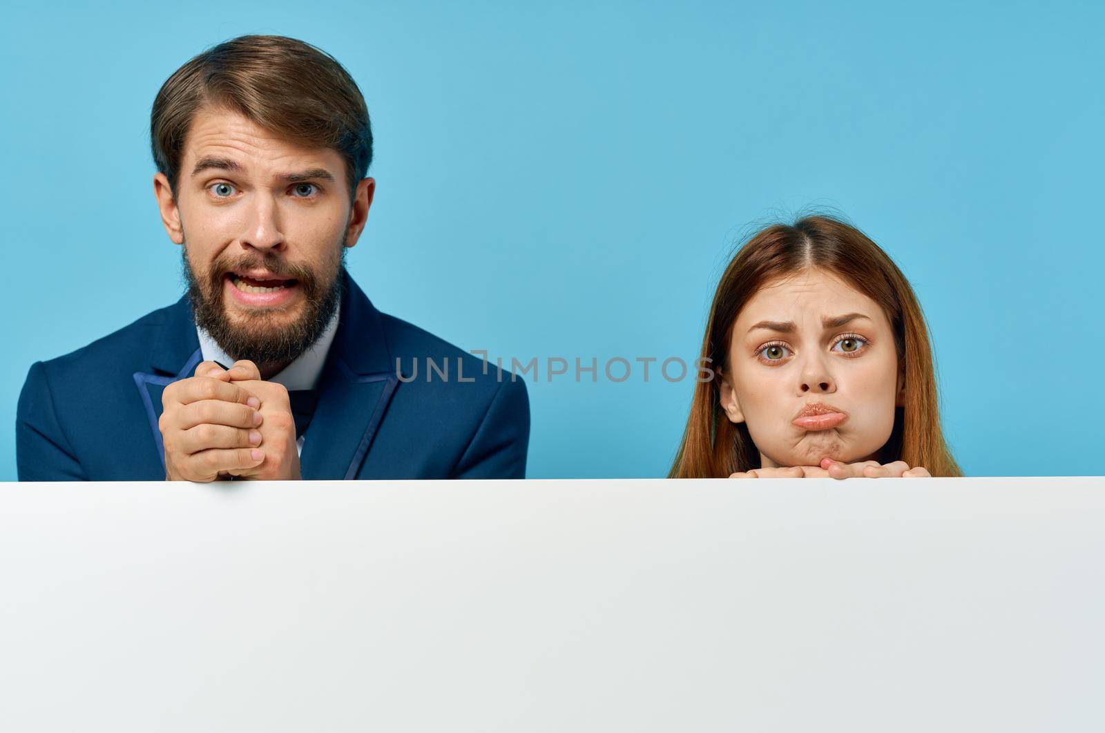 business man and woman billboard marketing fun emotions isolated background by SHOTPRIME