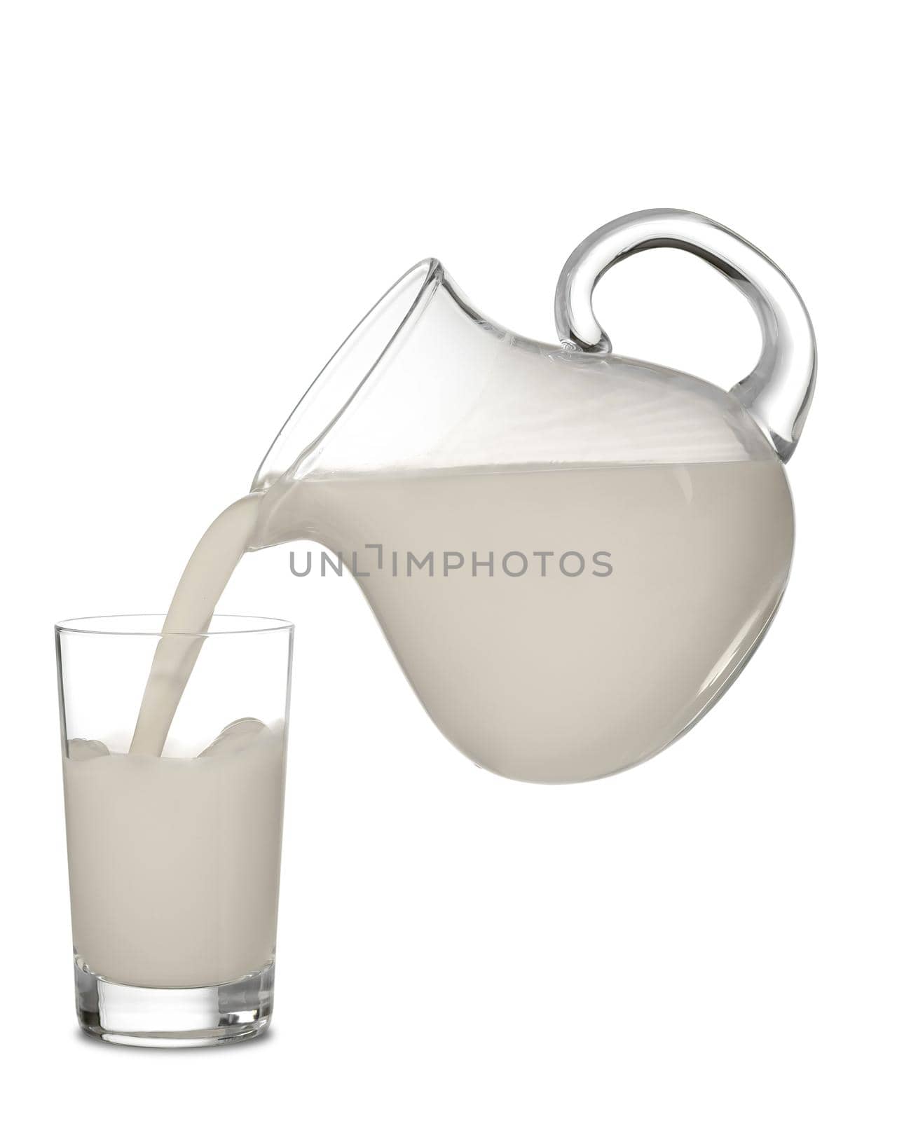 Almond milk is poured from a transparent jug into a glass. Isolated on white background.