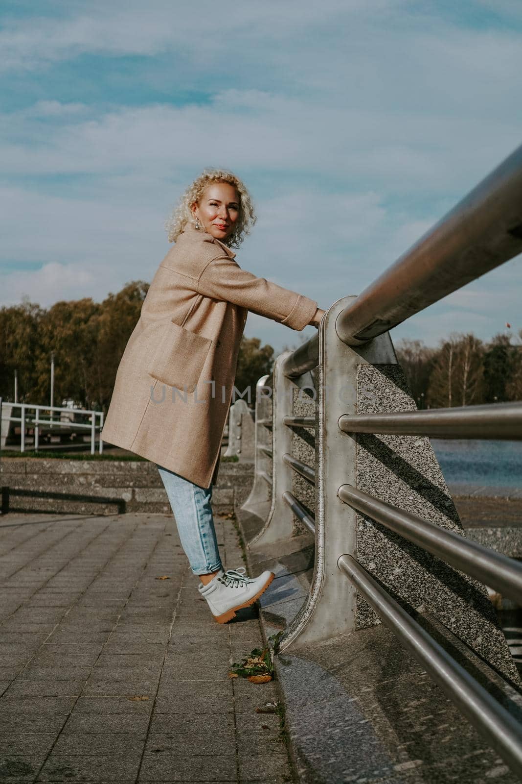 Stylish Pretty Young Woman in Autumn Fashion walking in the city