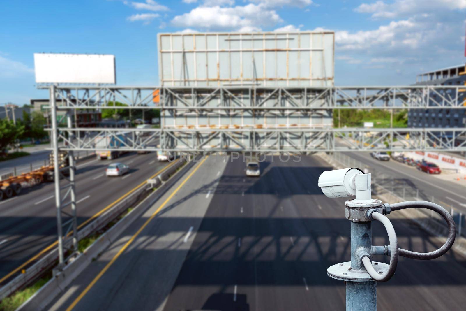 CCTV cameras on the overpass for recording road traffic. by wattanaphob
