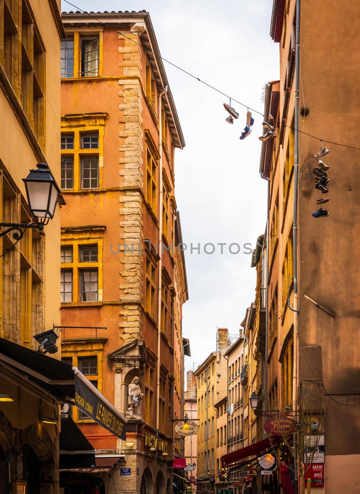 Old narrow street typical of old Lyon in the Rhône, Auvergne-Rhone-Alpes, France by Frederic