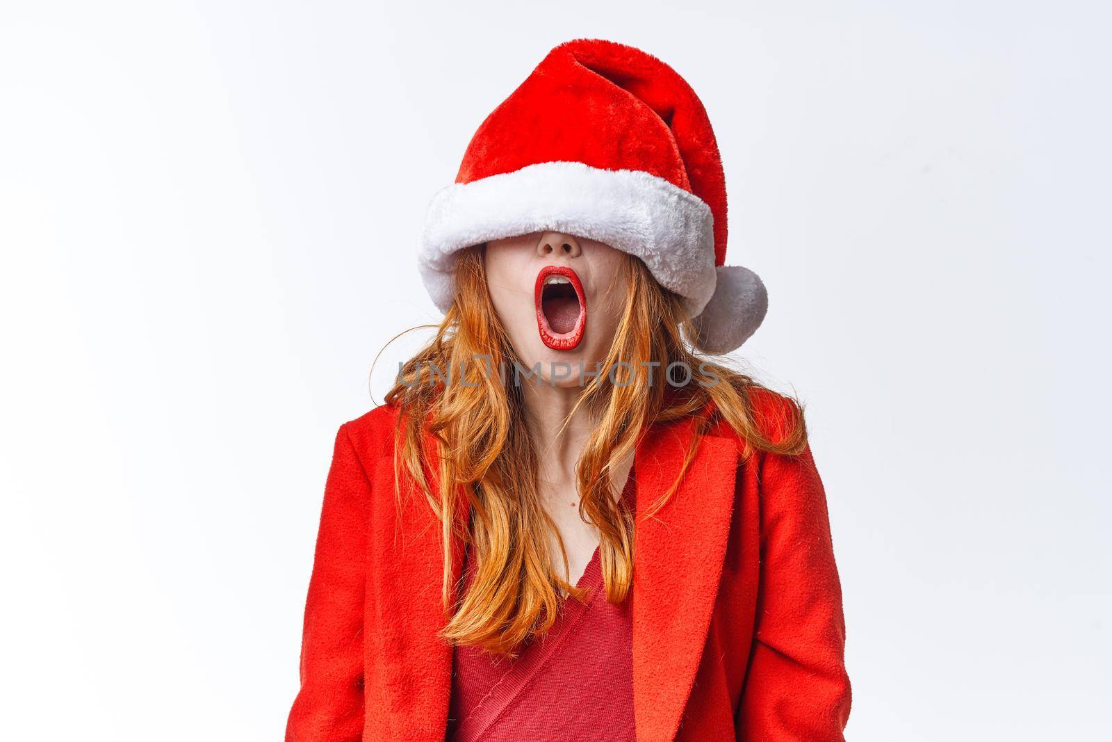 pretty woman in santa hat holiday christmas fun emotion by SHOTPRIME
