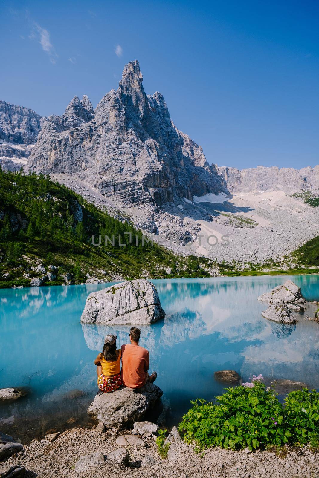 Lake Sorapis Italian Dolomites, Morning with clear sky on Lago di Sorapis in italian Dolomites, lake with unique turquoise color water in Belluno province in Nothern Italy by fokkebok