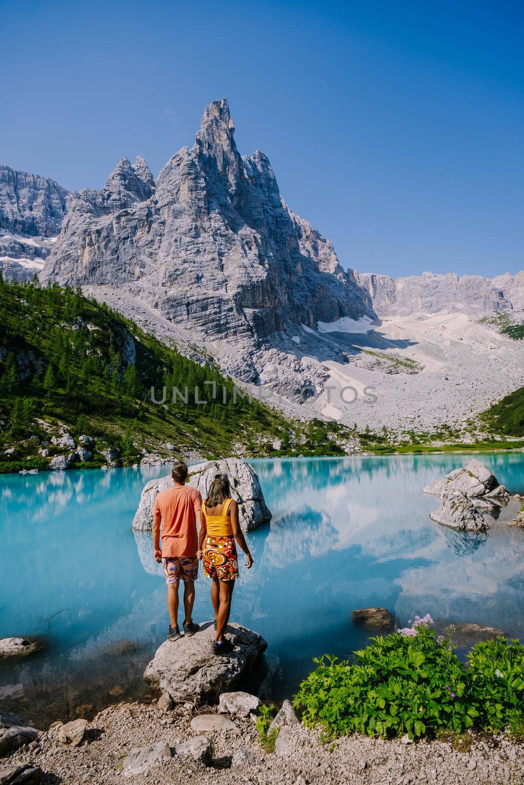 Lake Sorapis Italian Dolomites, Morning with clear sky on Lago di Sorapis in italian Dolomites, lake with unique turquoise color water in Belluno province in Nothern Italy by fokkebok