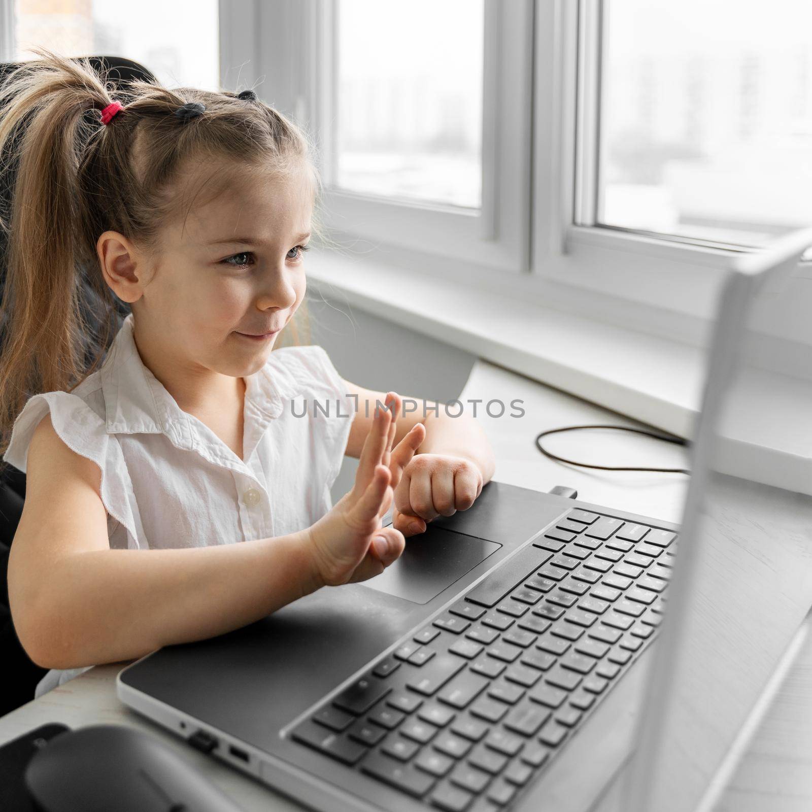 child girl is engaged in online mental arithmetic with a teacher. distance preschool education