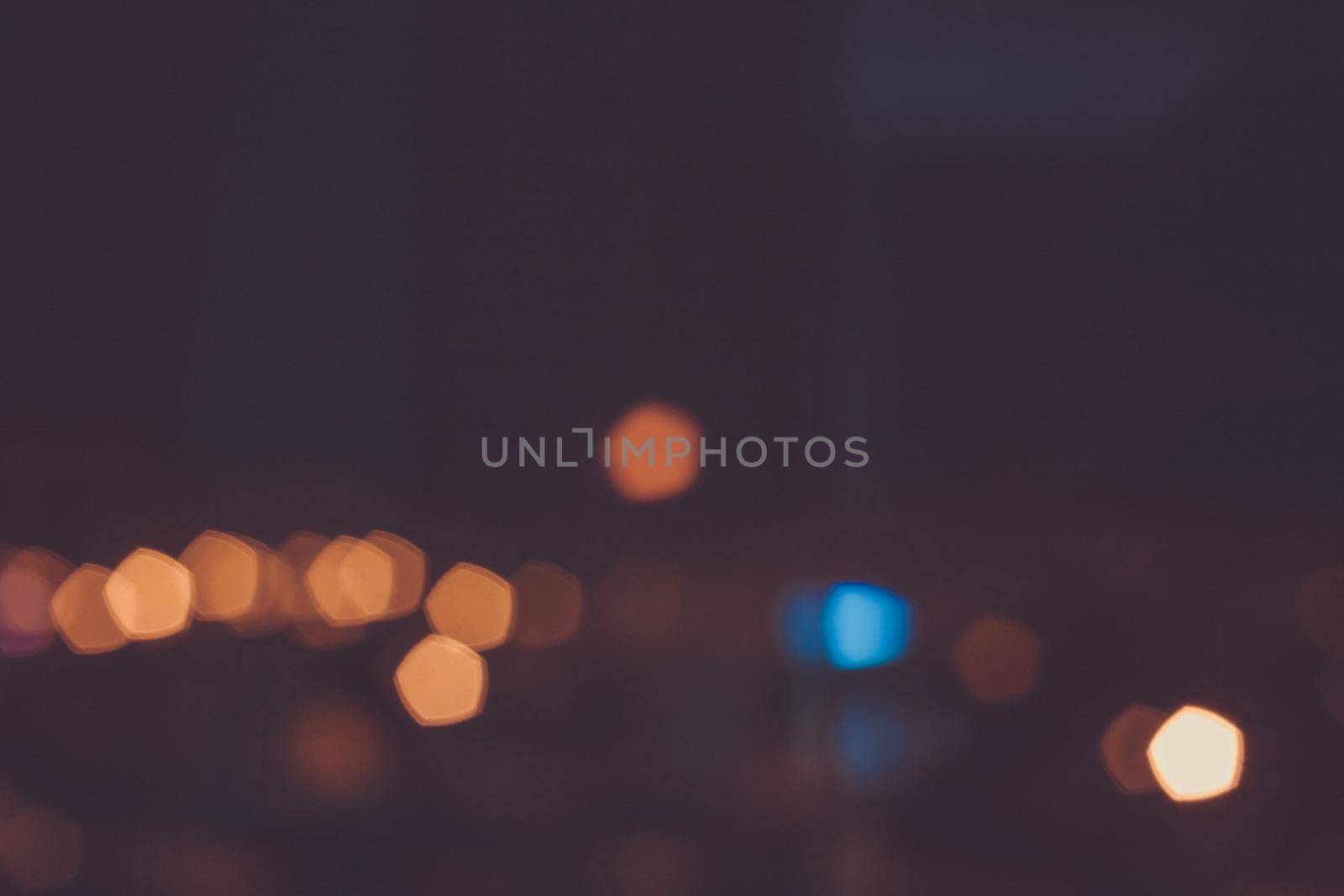 Night lights bokeh background. City flashlights defocused