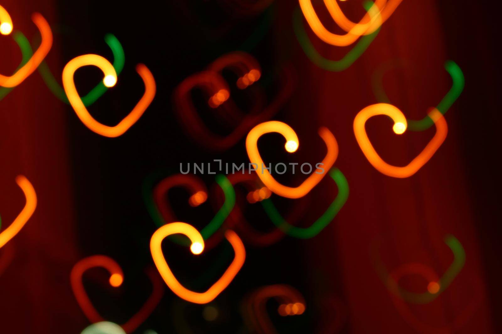 abstract heart bokeh orange lights on dark background