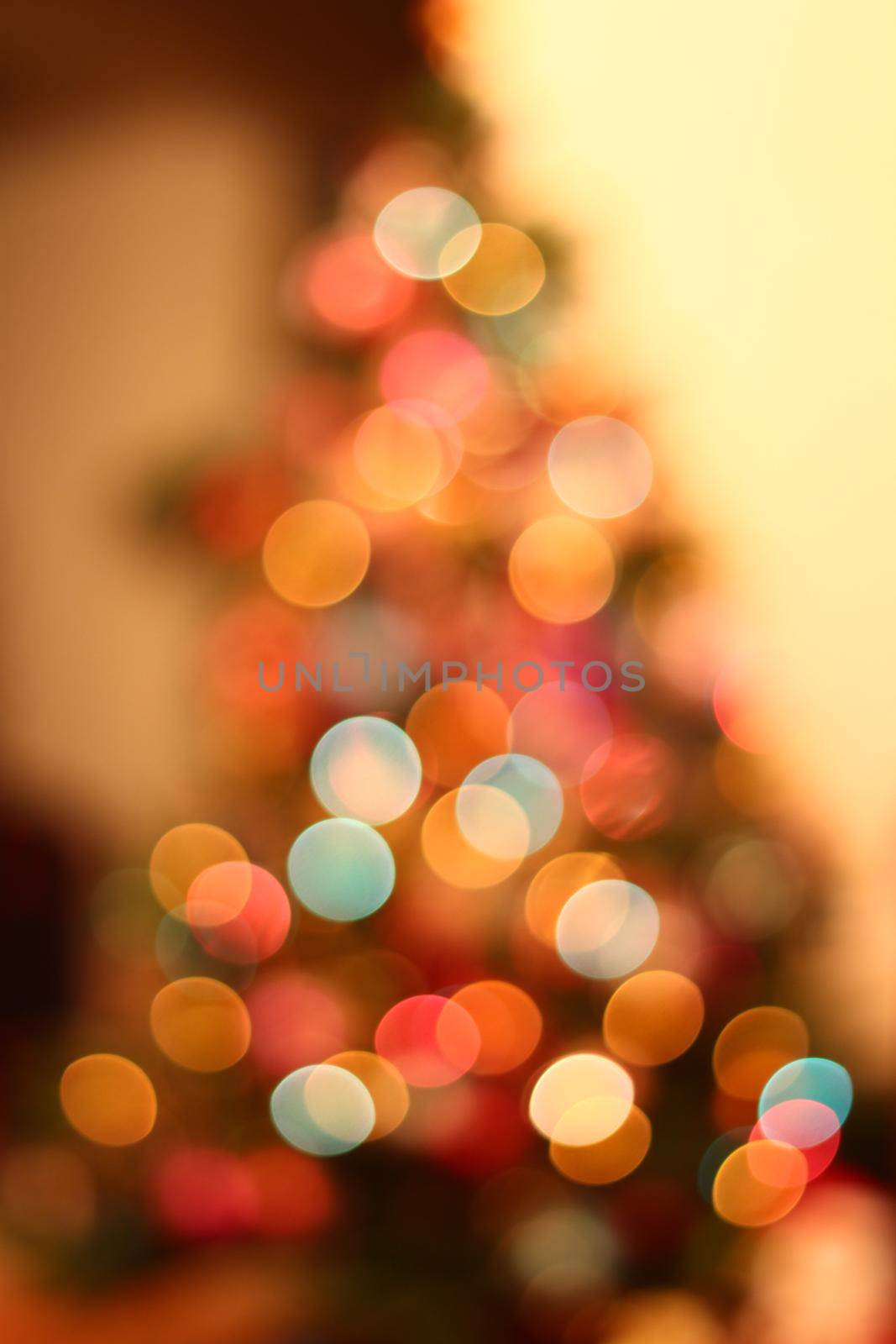 Christmas lights on xmas tree defocused. Holiday bokeh background