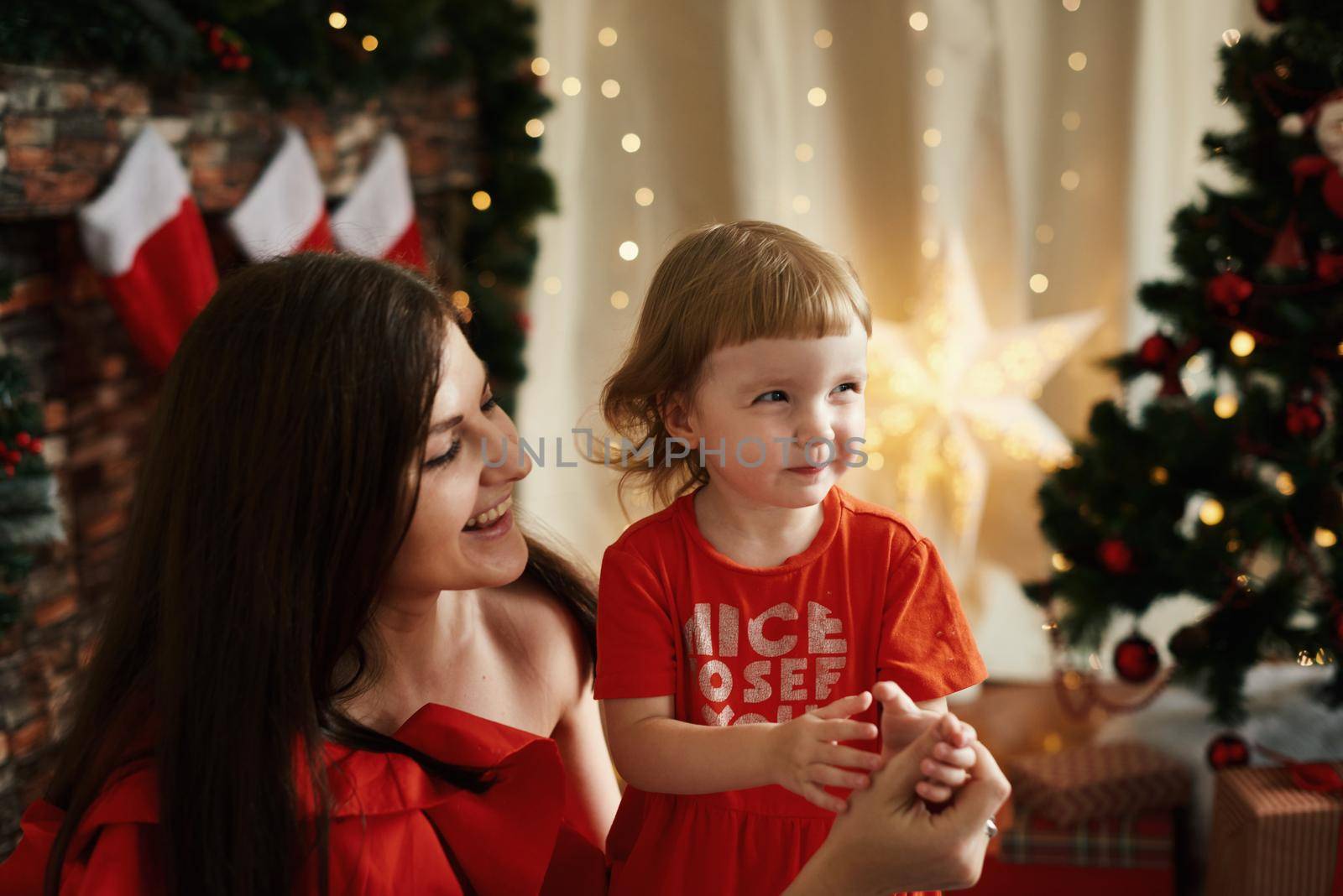 Family mother and daughter having fun at home together. Happy family. New Year. Spend time together at home. Gift giving around the world. Happy winter season time. Candid moment