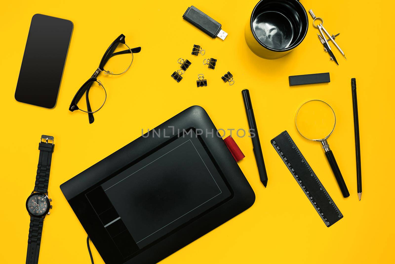 Workplace with office items and business elements on a yellow background. Concept for branding. Top view. Copy space. Still life