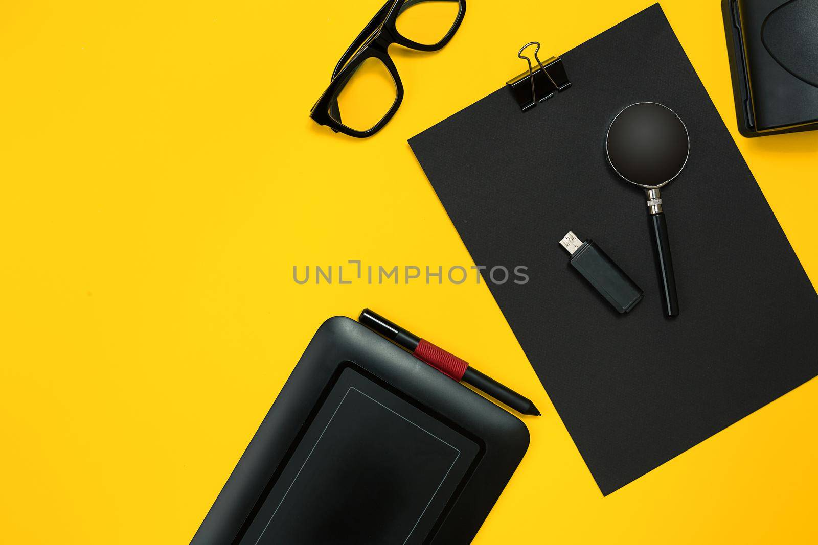 Workplace with office items and business elements on a yellow background. Concept for branding. Top view. Copy space. Still life