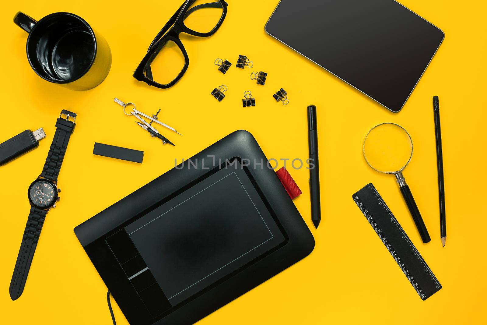 Workplace with office items and business elements on a yellow background. Concept for branding. Top view. Copy space. Still life