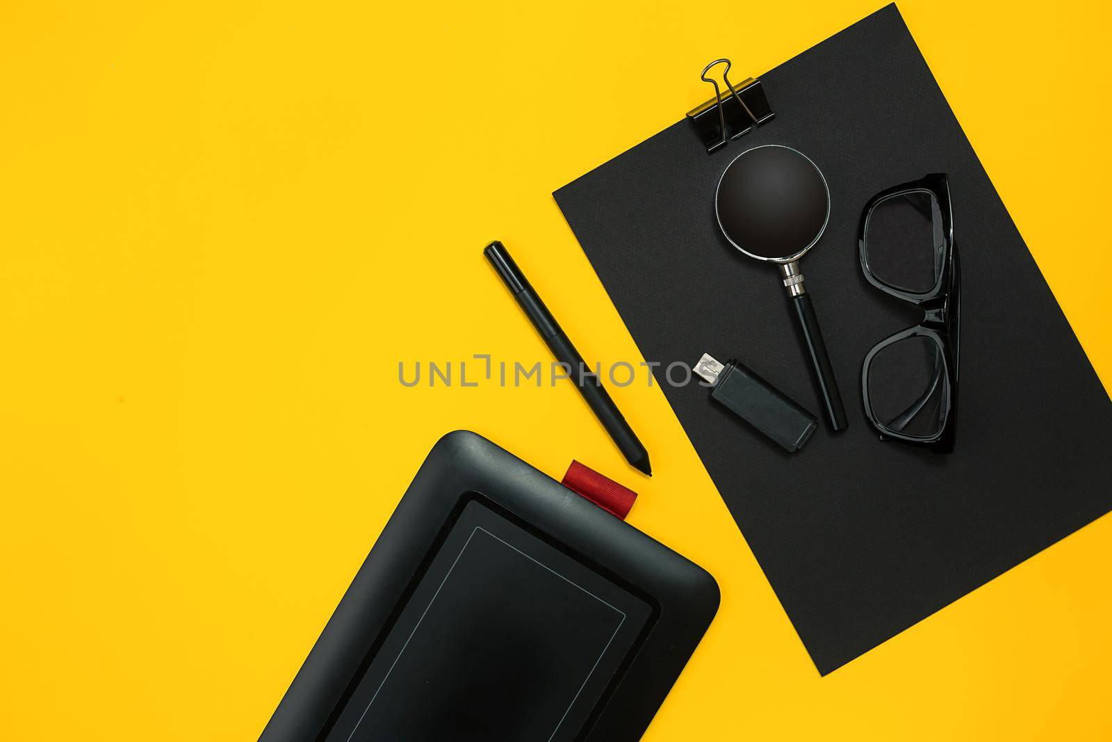 Workplace with office items and business elements on a yellow background. Concept for branding. Top view. Copy space. Still life