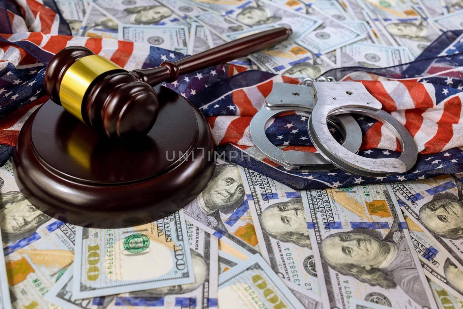 Financial regulation of american economic sanctions with US dollars banknotes handcuffs Judge gavel by ungvar