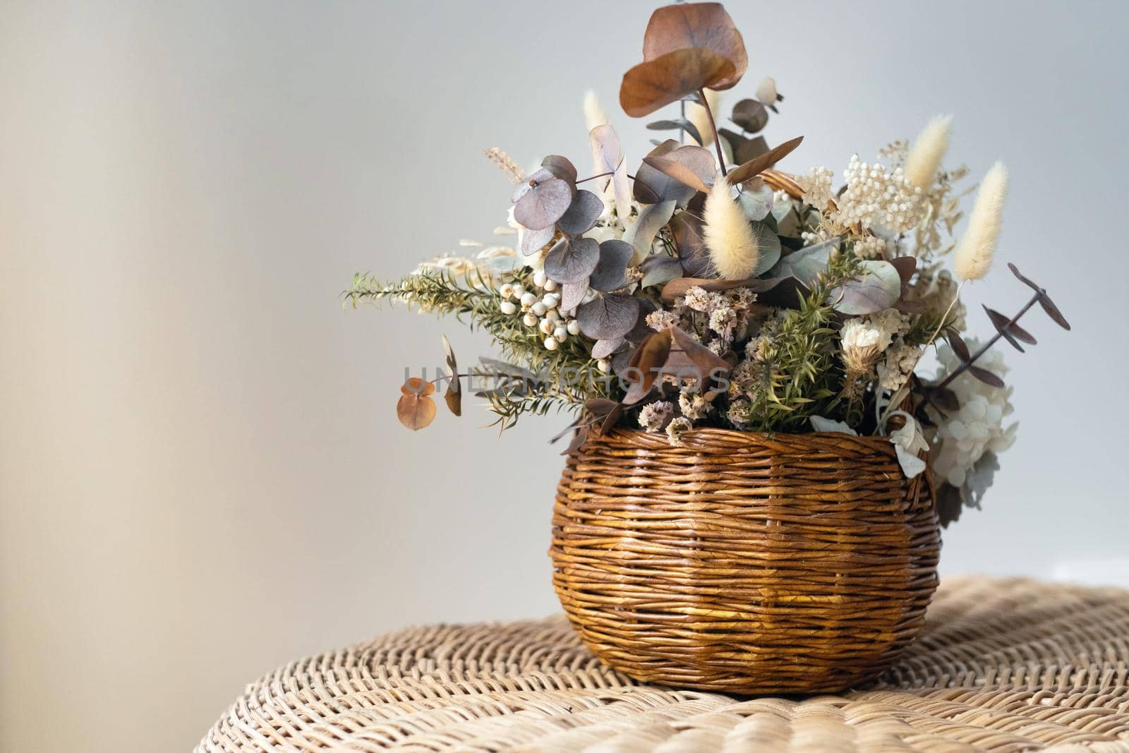 Straw Basket with artificial dried flowers.