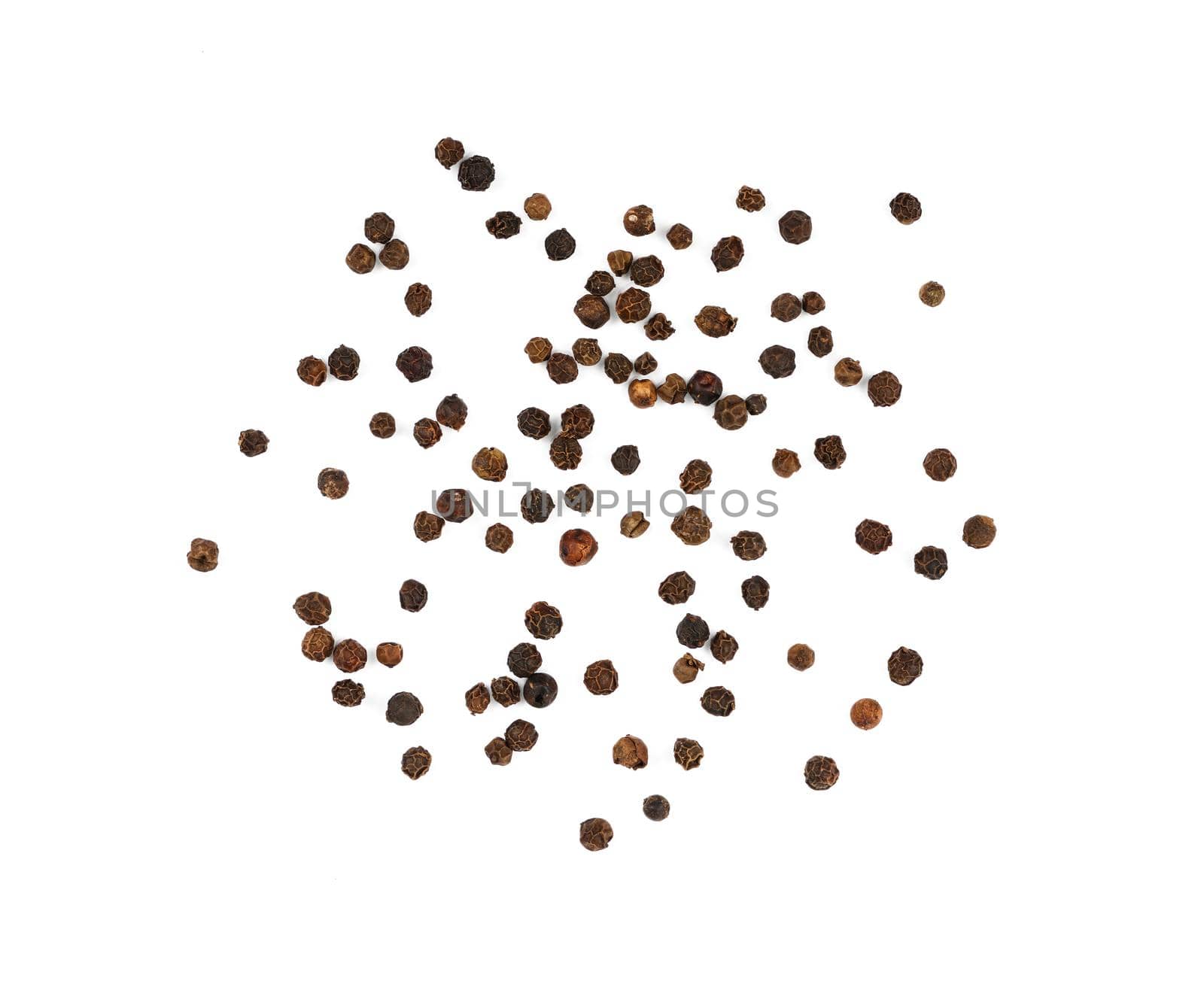 Heap of black peppercorns isolated by BreakingTheWalls