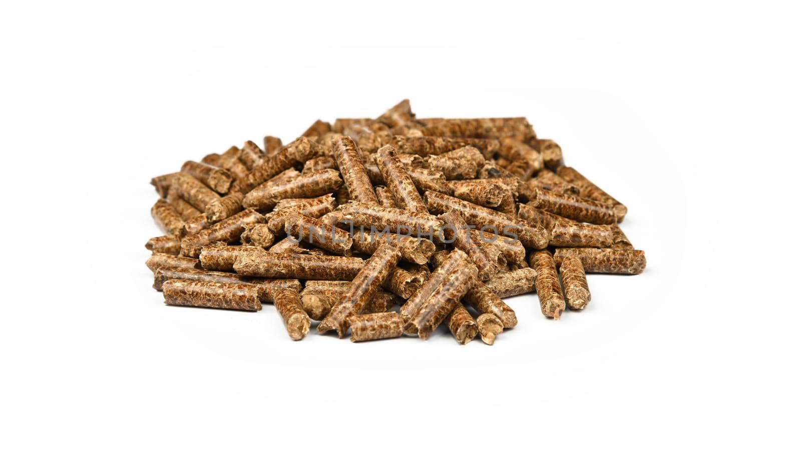 Close up pile of hardwood pellets for natural food smoking and cooking, isolated on white background, high angle view