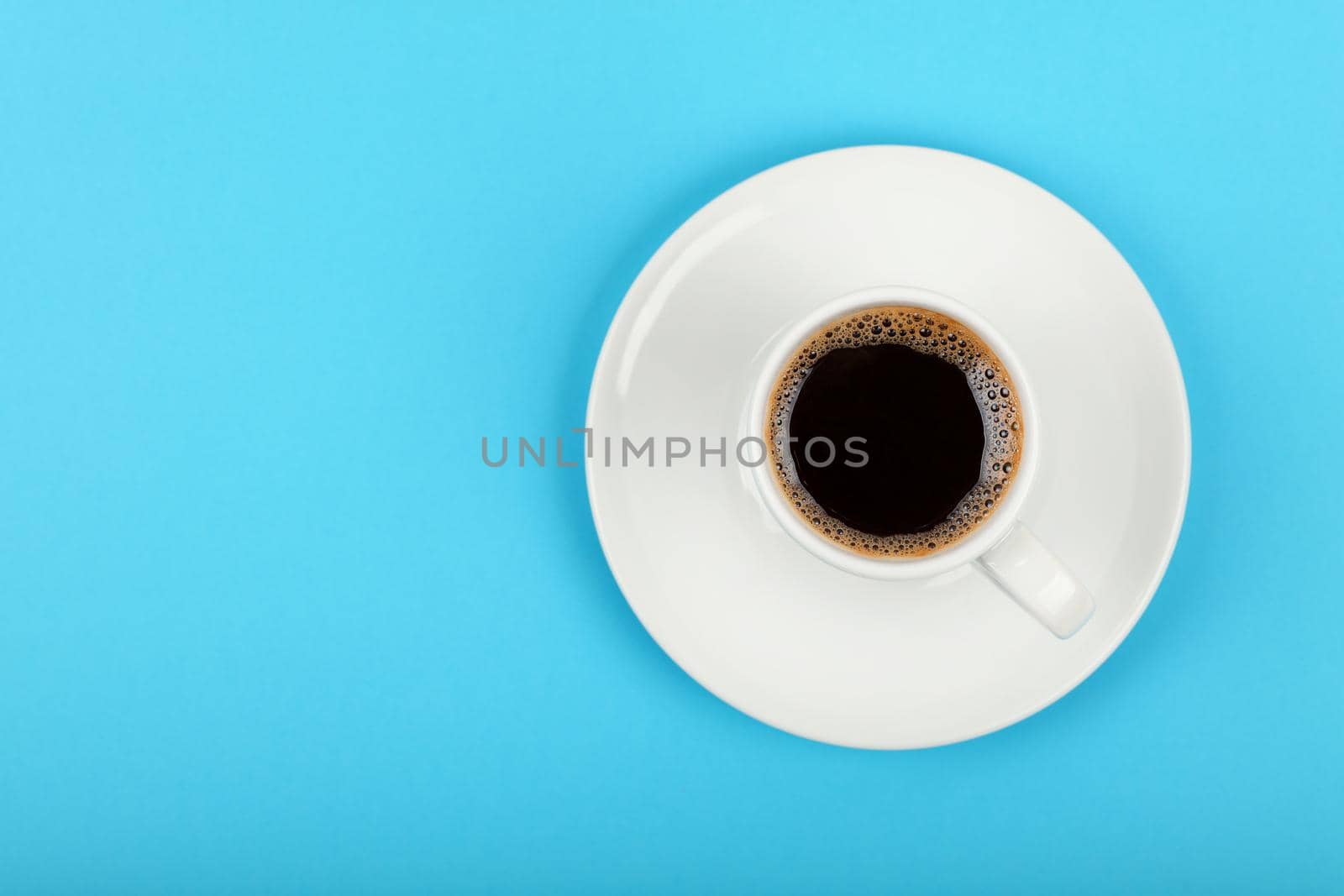 Full white espresso coffee cup over blue by BreakingTheWalls