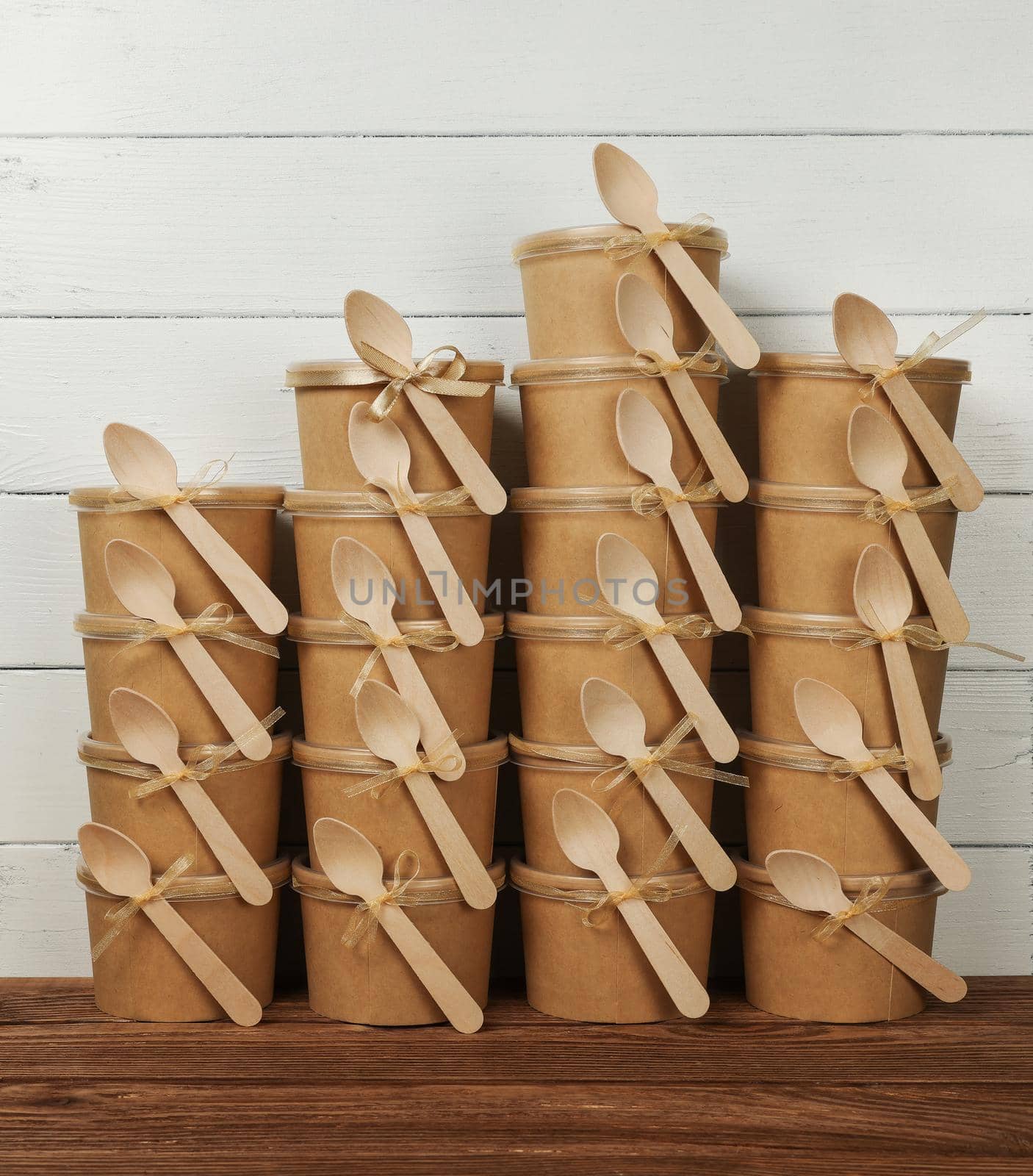 Stack of brown paper cups with dessert by BreakingTheWalls