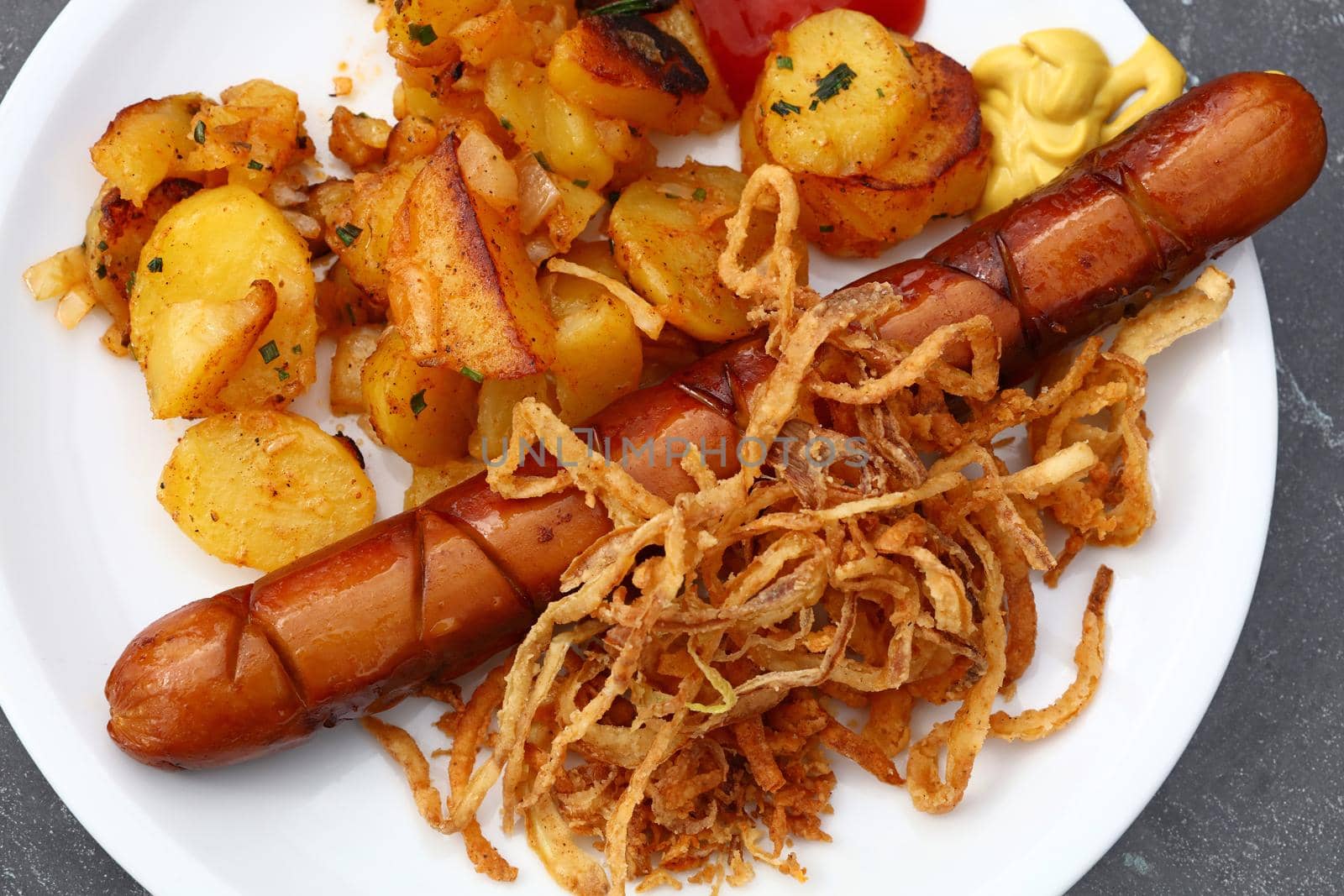 Close up portion of sausage with roasted potato by BreakingTheWalls