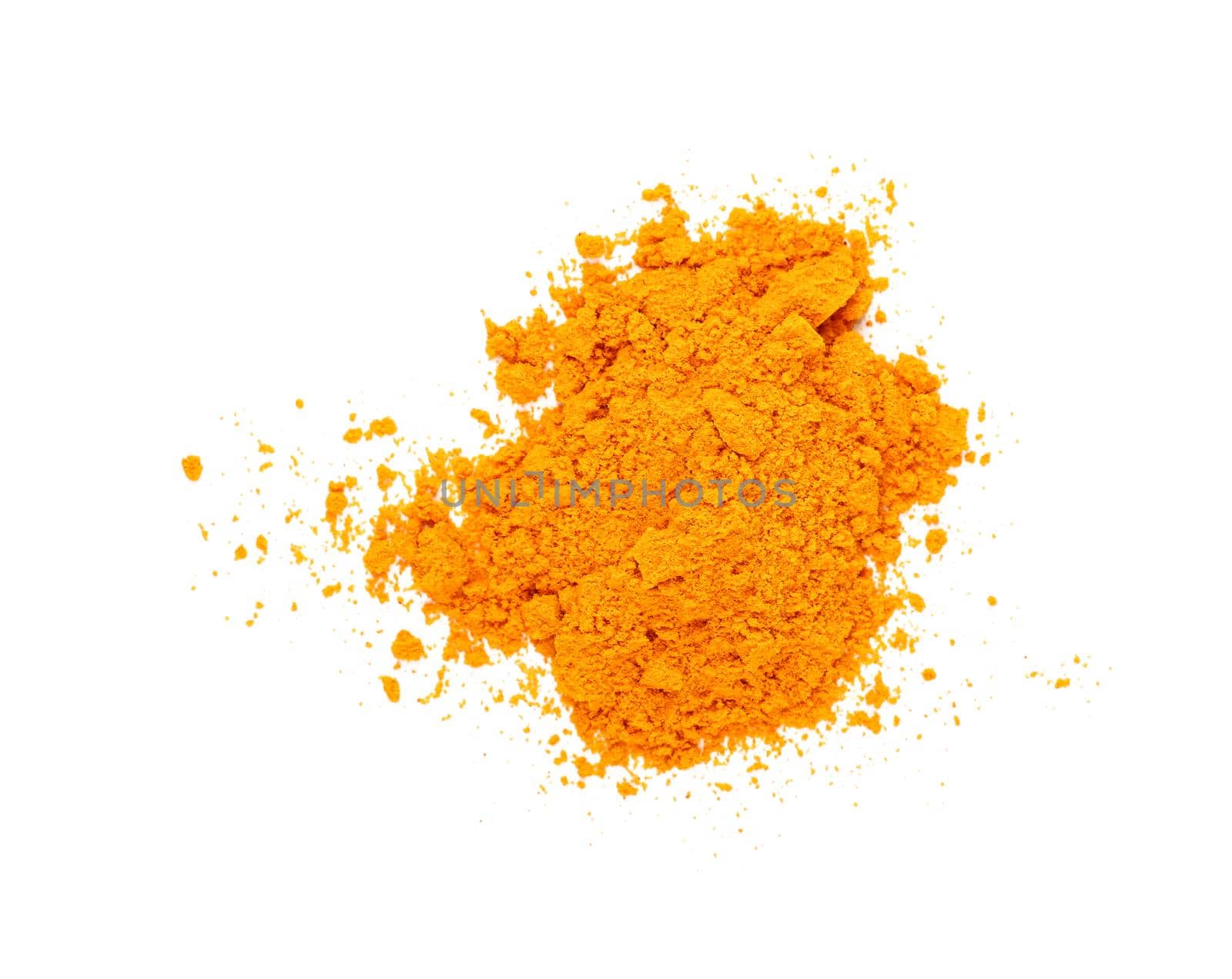 Close up one heap of yellow turmeric spice powder spilled and spread around isolated on white background, elevated top view, directly above