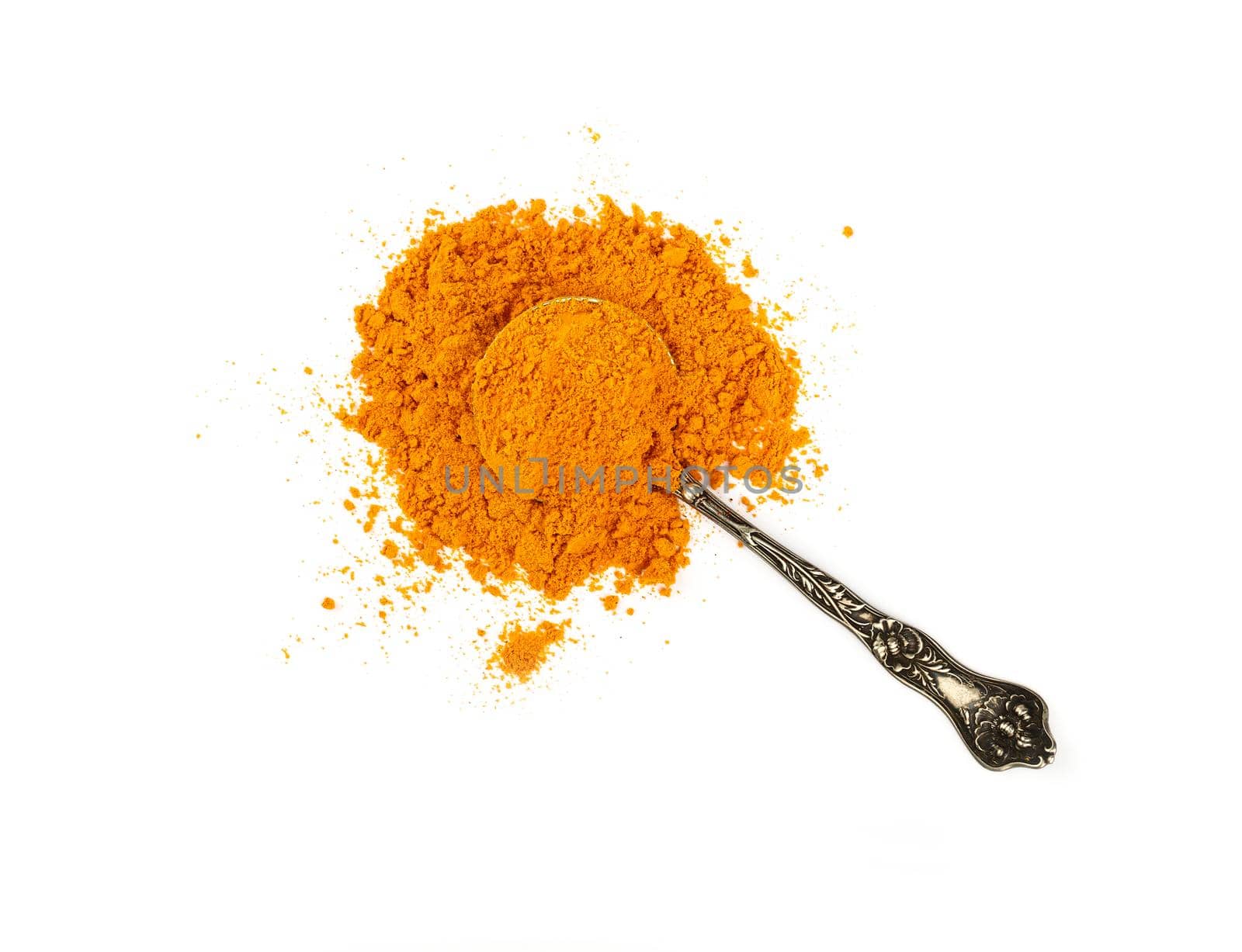 Metal spoon full of yellow turmeric powder by BreakingTheWalls
