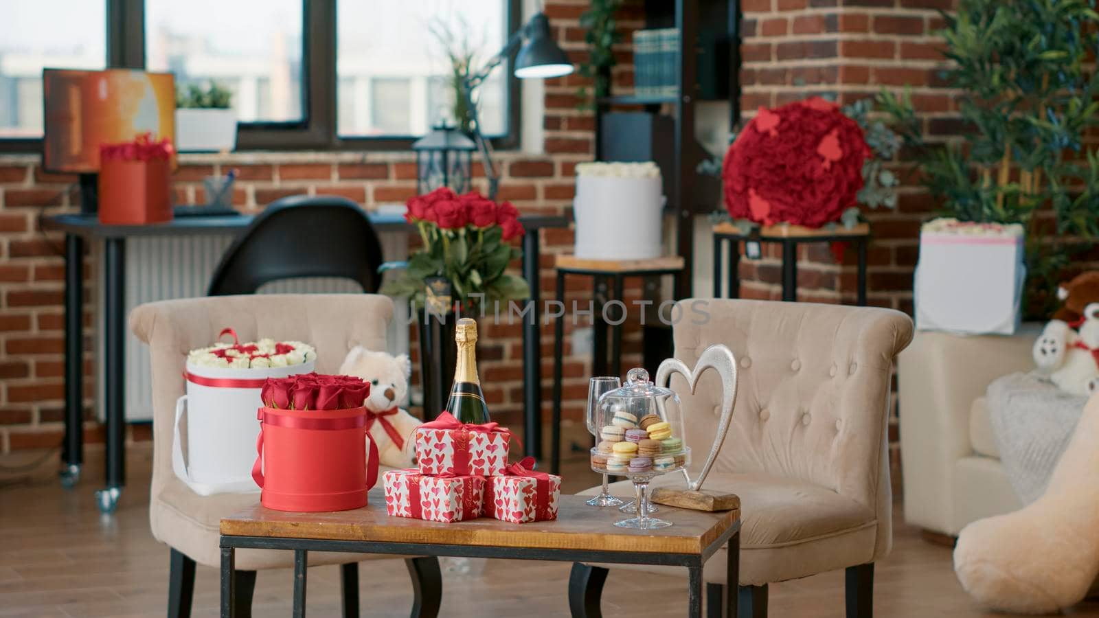 Empty living room decorated by boyfriend with valentine day romantic presents for girlfriend to celebrate romance anniversary at home. Living room with red roses on table. Concept of valentines-gift