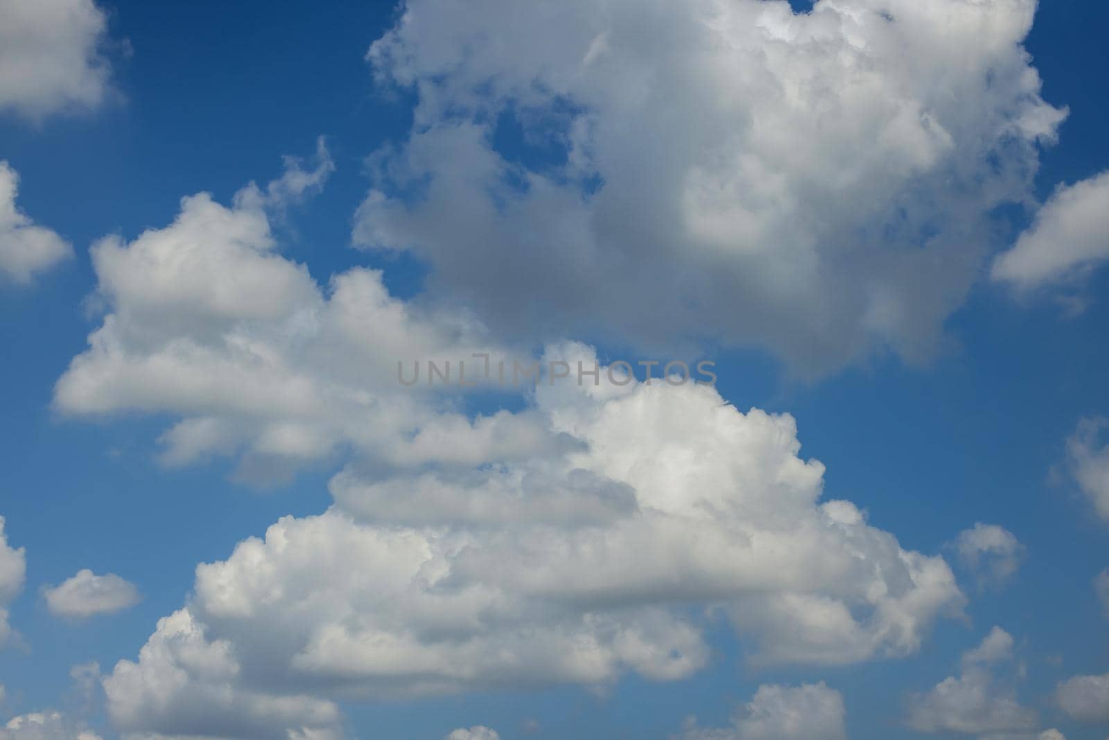 White clouds with blue sky background by ungvar