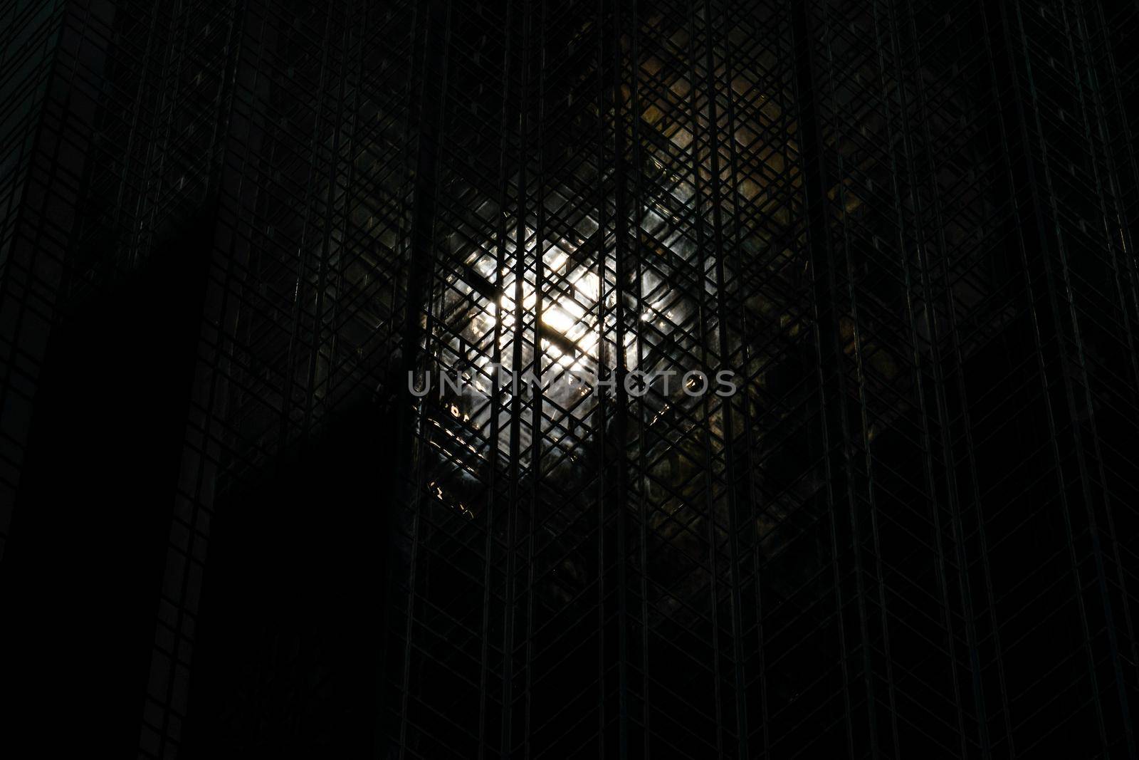 Sun (New York) reflecting on playing cards tower. Shooting Location: New York, Manhattan