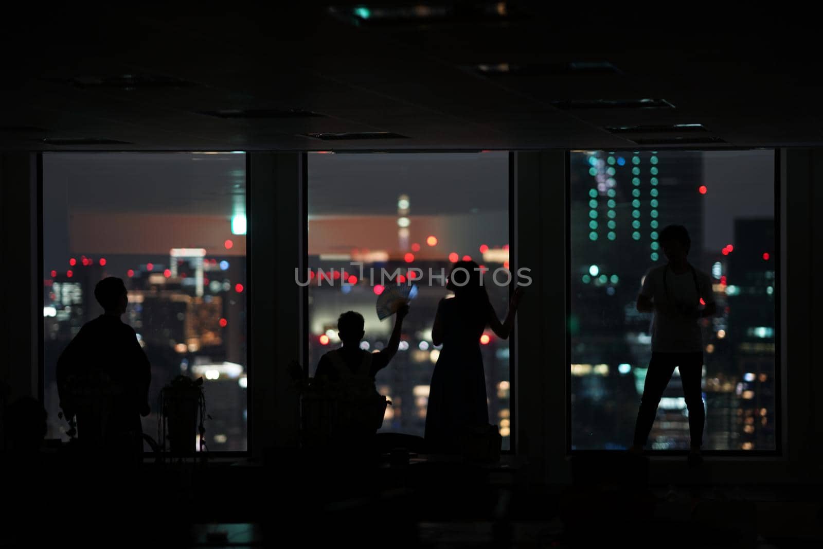 Silhouette of urban night view and people. Shooting Location: Tokyo metropolitan area