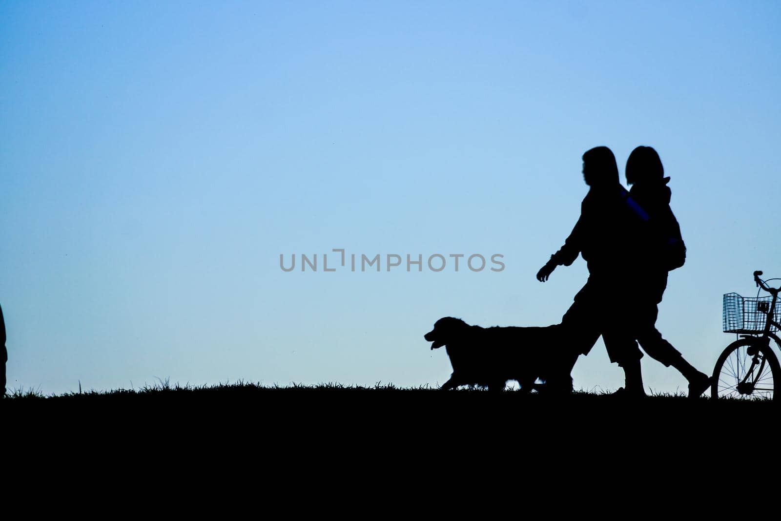Silhouette image of people standing on the hill (wallpaper material). Shooting Location: Tokyo metropolitan area