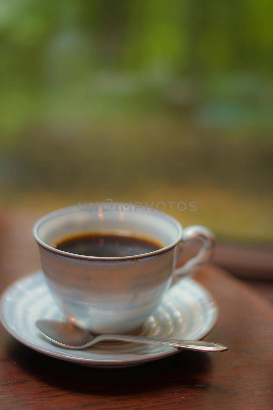 Coffee placed in the table by the window. Shooting Location: Hokkaido Furano